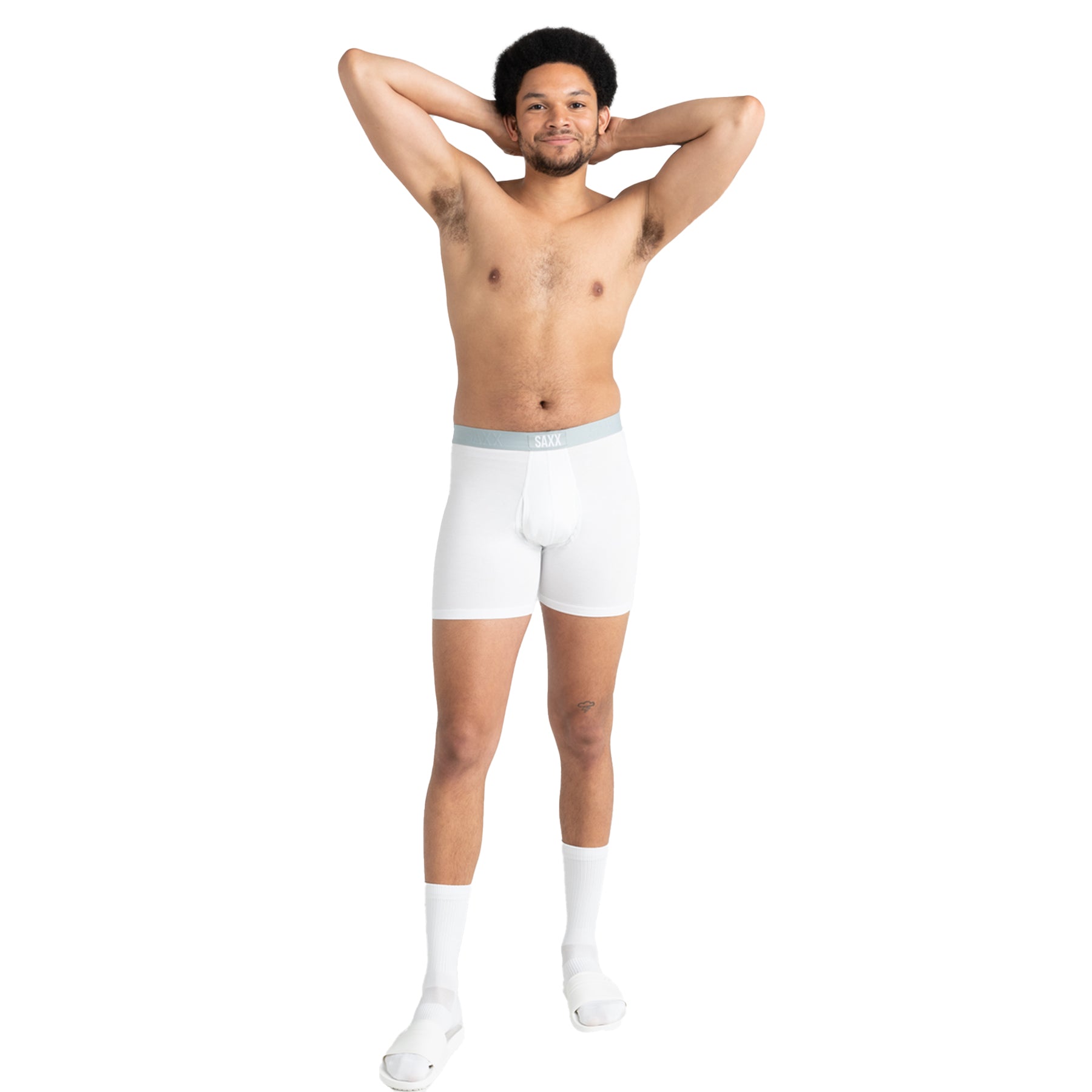 Man wearing white boxer briefs on a white background