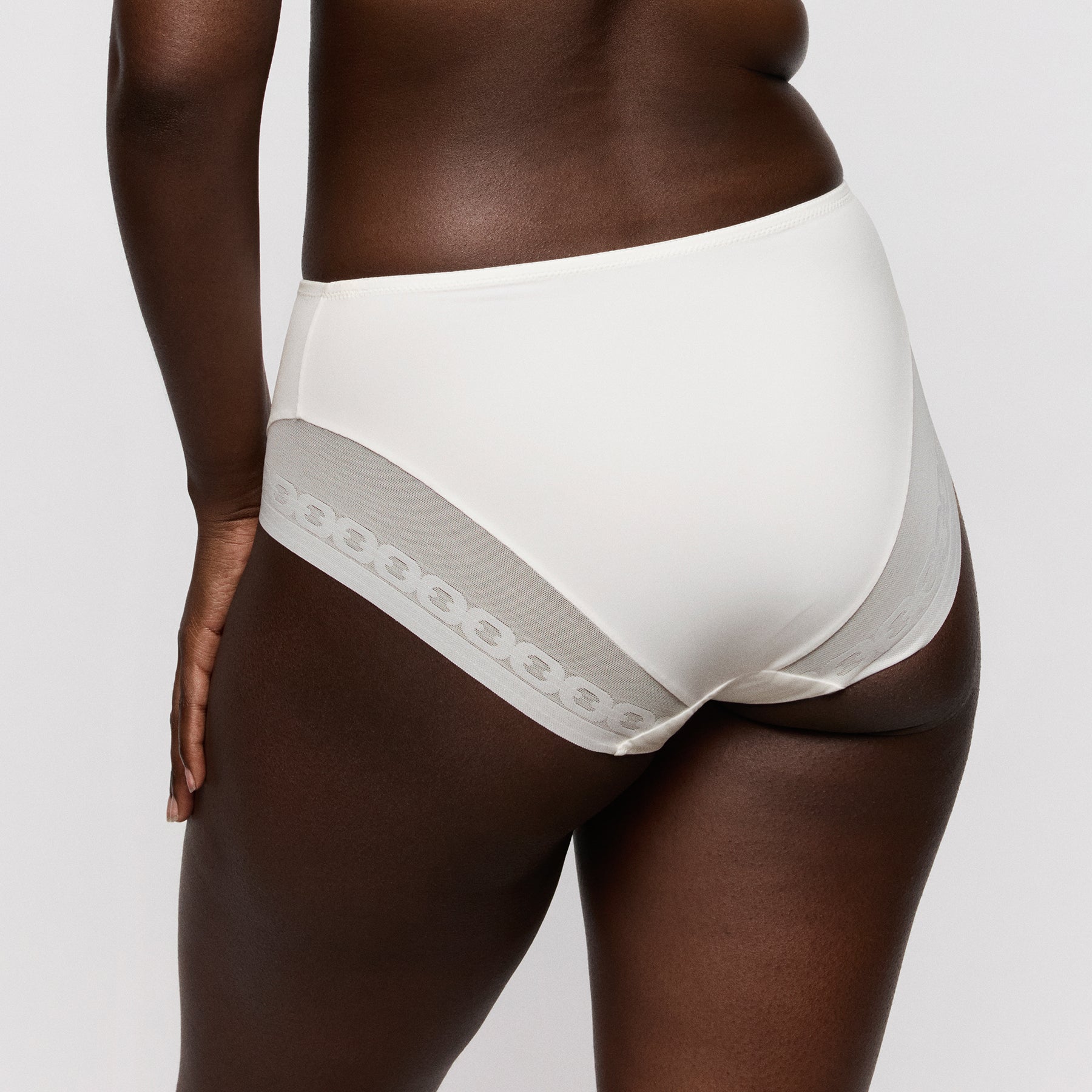 Primadonna twist Twixie full brief 0542531 in natural ivory. Rear view close up on model.