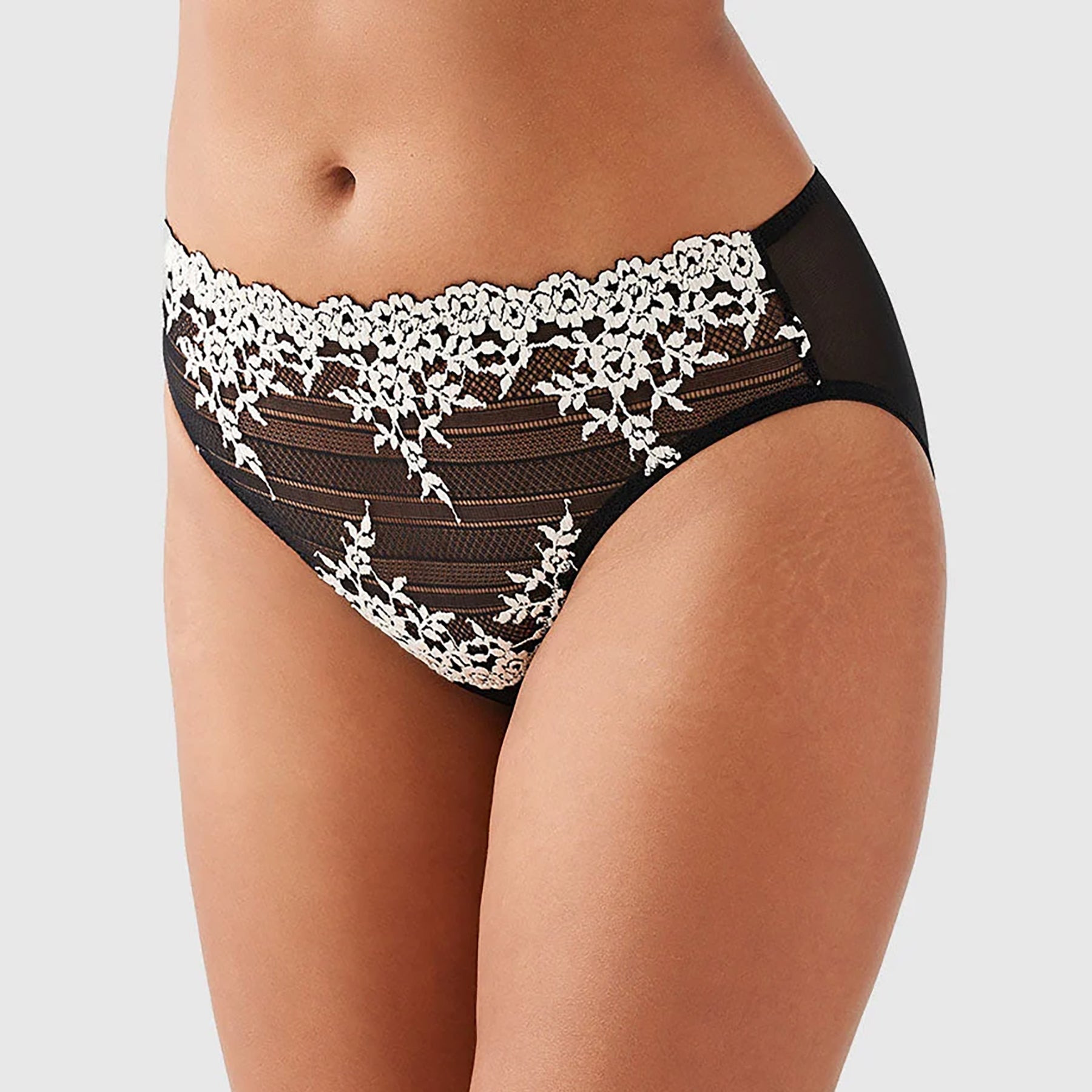 Wacoal embrace lace high waist sheer black mesh brief 841191 with cream lace embroidery details. Side view close up on model.