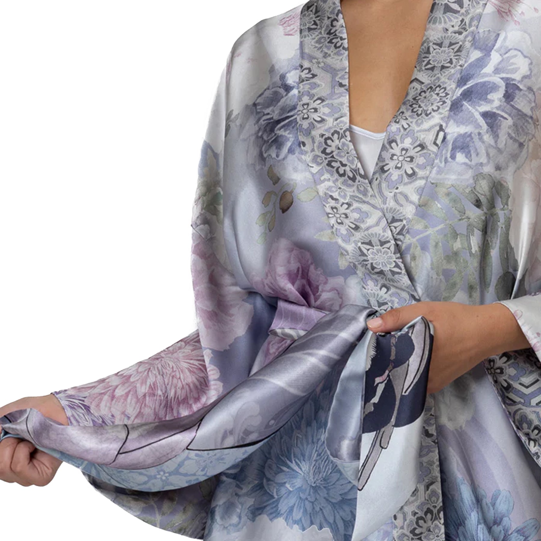 Close-up of luxury satin robe with intricate floral pattern and wide kimono sleeves, soft sheen fabric