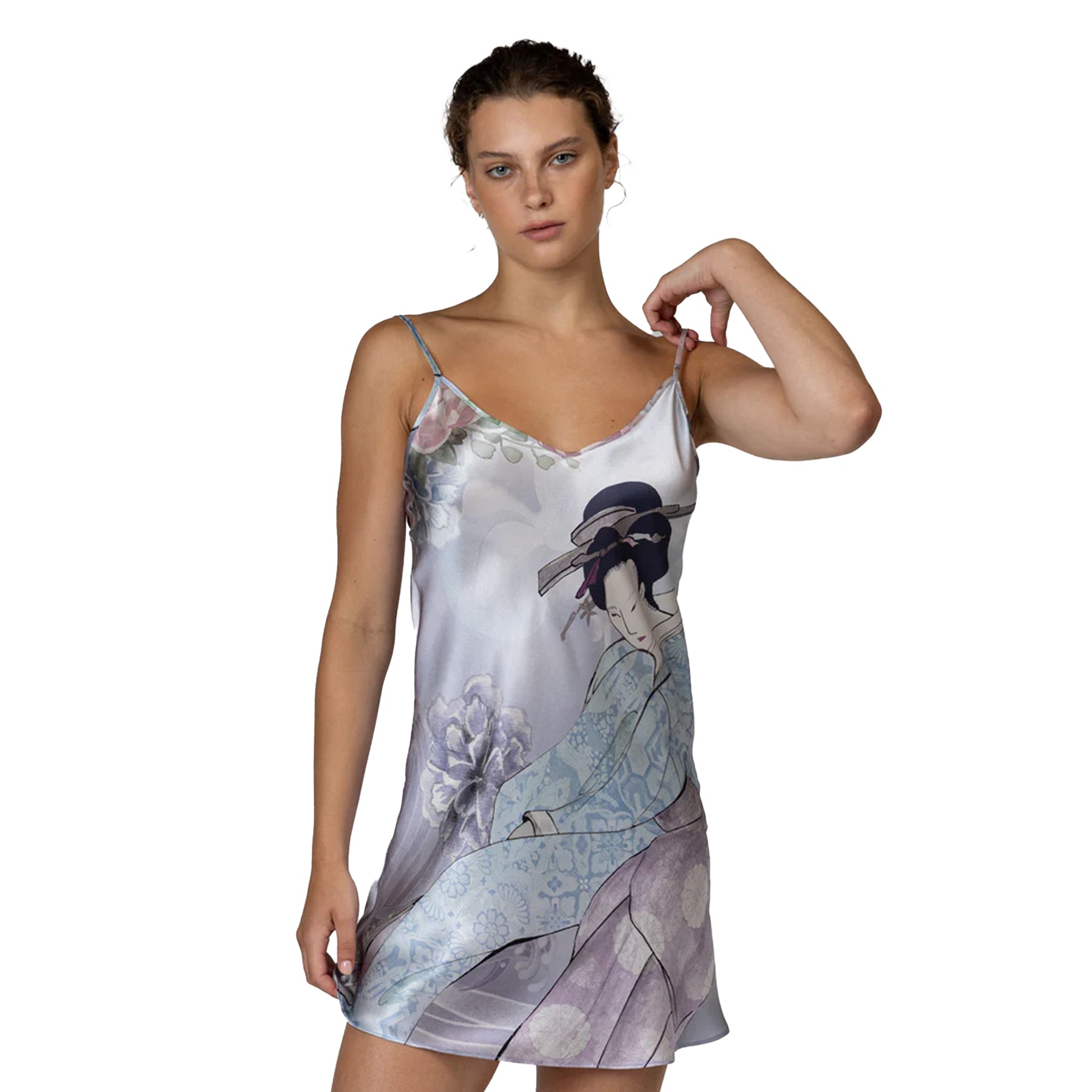Close-up of printed slip dress featuring geisha artwork and soft floral detailing on silky fabric