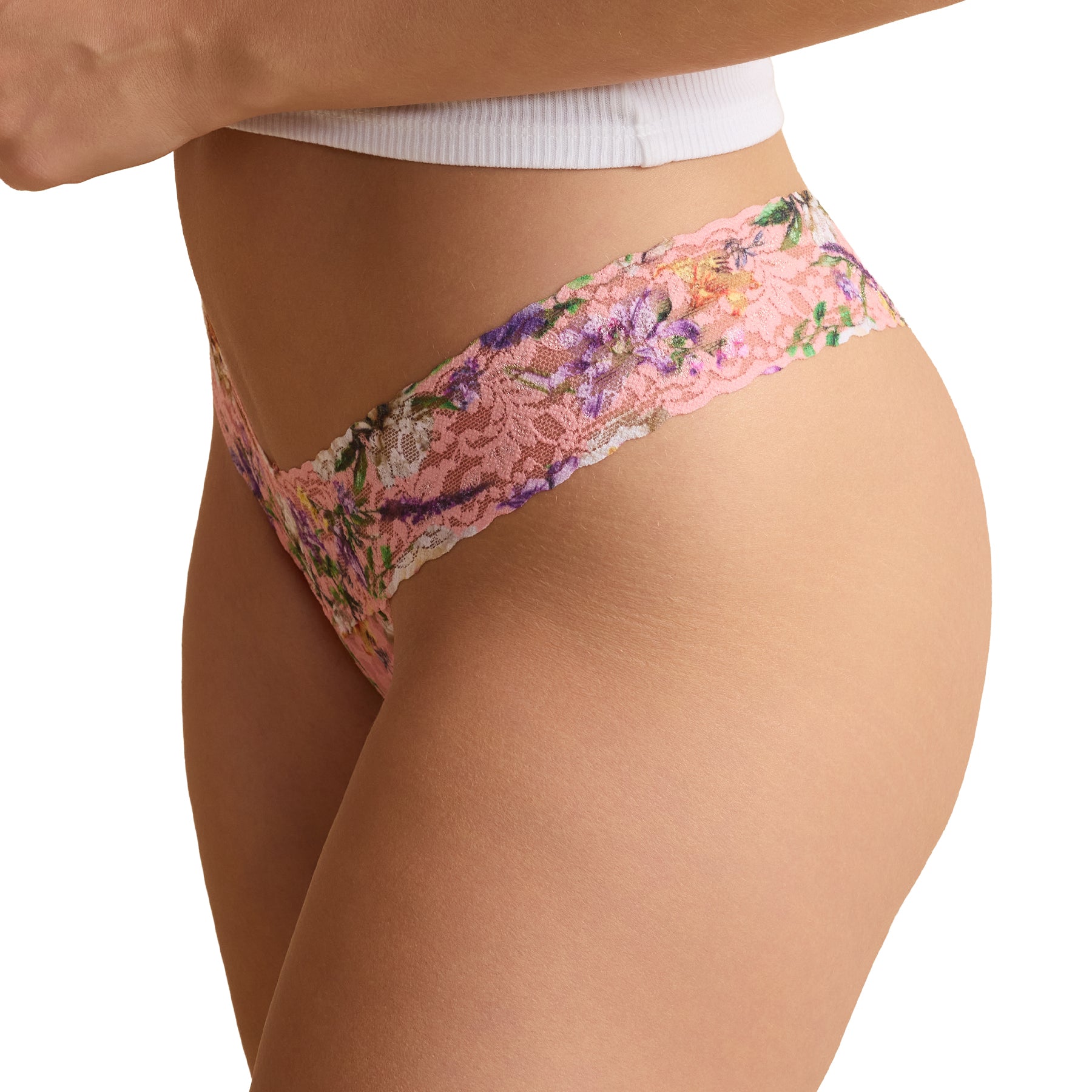 Pink floral lace thong underwear on model, side view showing scalloped lace waistband and soft stretch fit.