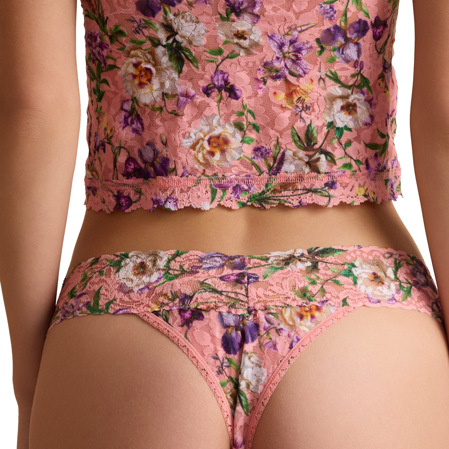 Back view of pink floral lace thong underwear on model with delicate floral lace and scalloped waistband.