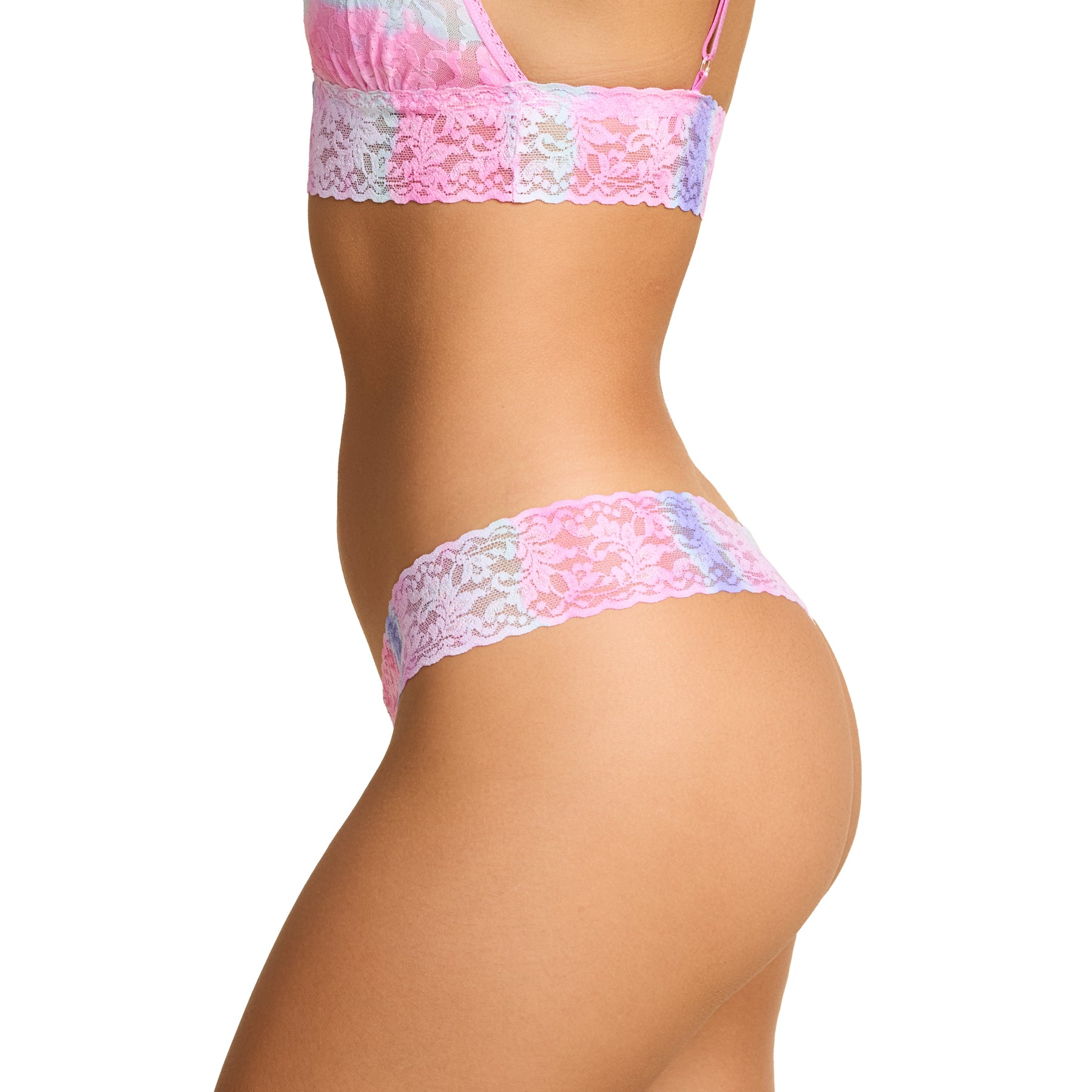 Pink tie-dye lace thong underwear on model, side view showing wide floral lace waistband.
