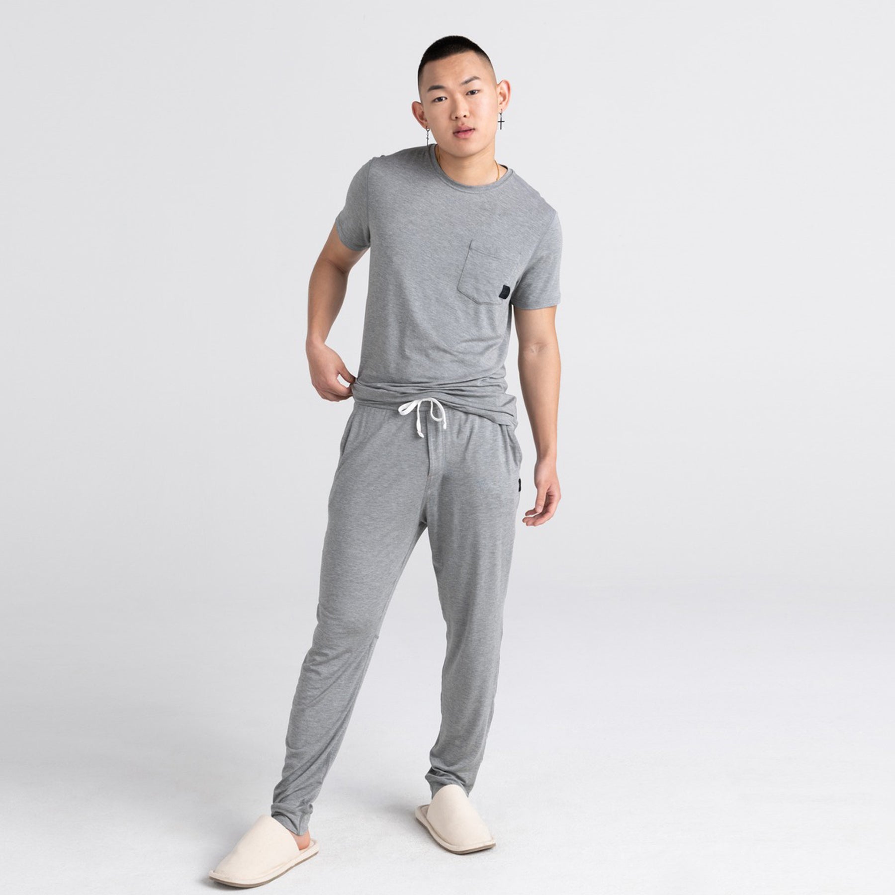 Grey lounge pants styled with a matching T-shirt and slippers.