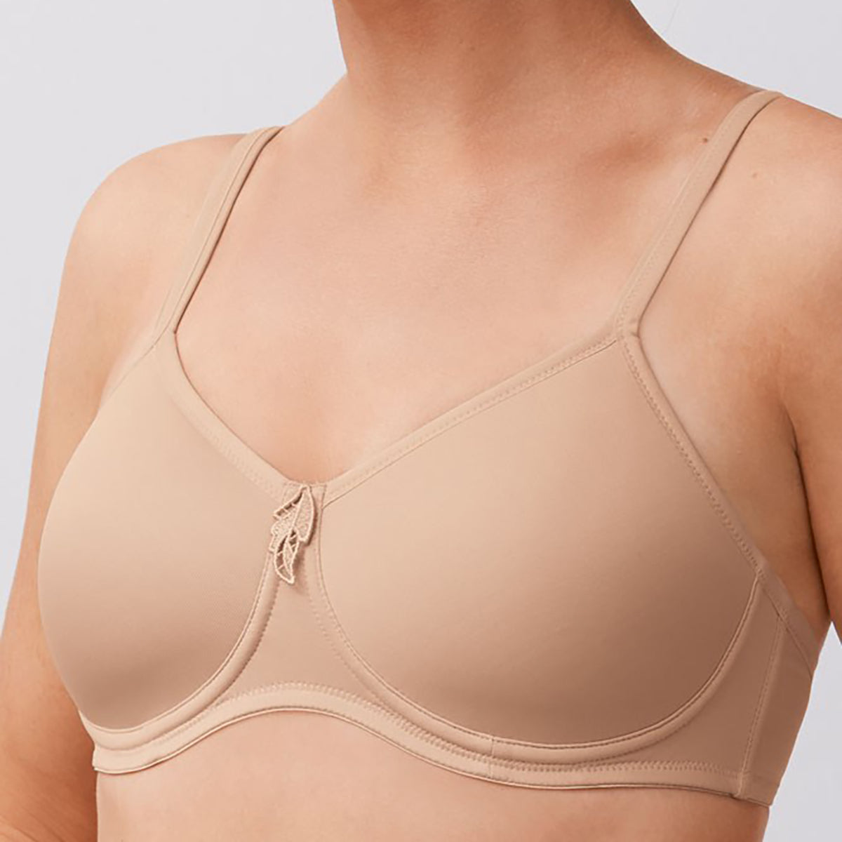 Amoena wireless molded Lara bra in nude on model side profile