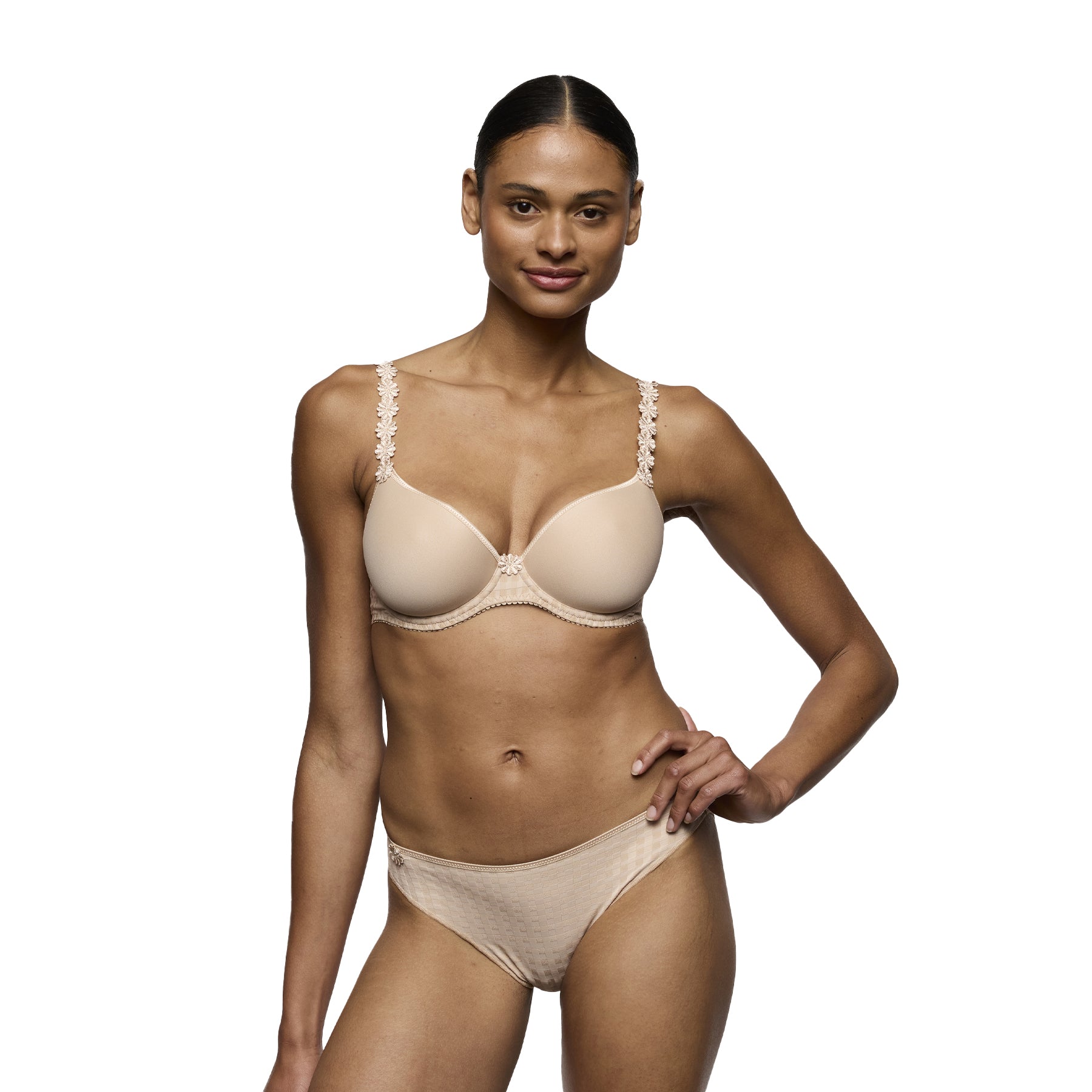 Beige smooth molded bra with floral lace straps and matching brief set on model, seamless everyday lingerie in café latte tone