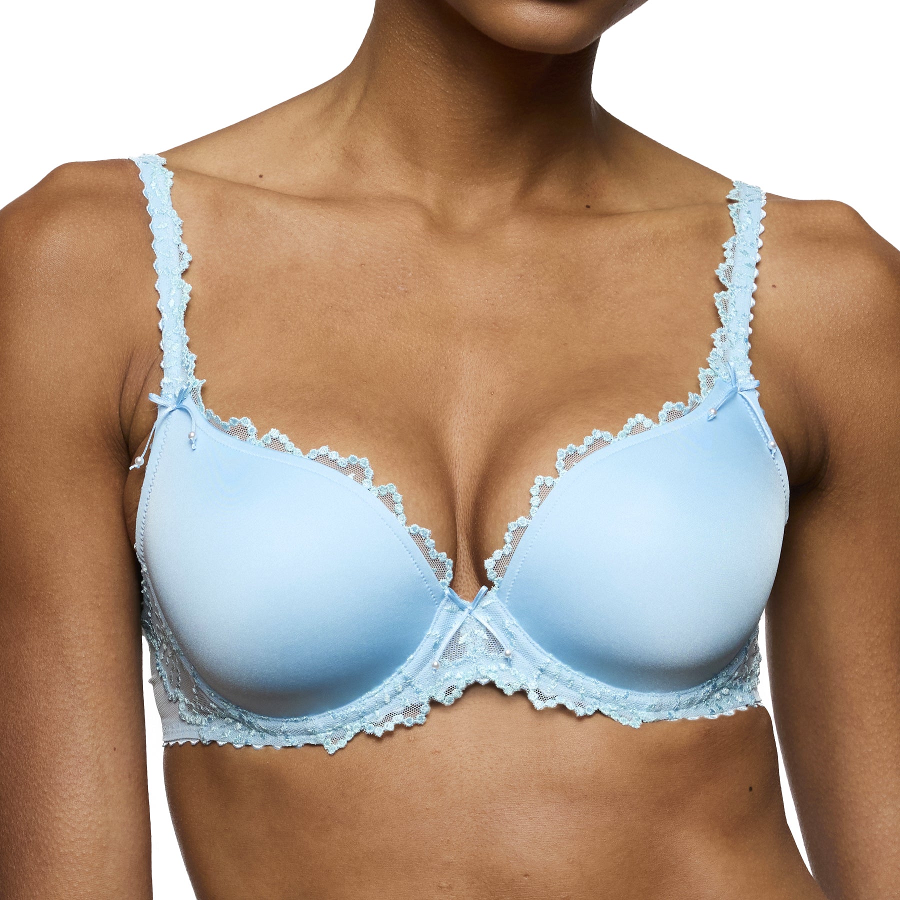 Light blue lace bra on model front view with smooth cups and scalloped lace edging