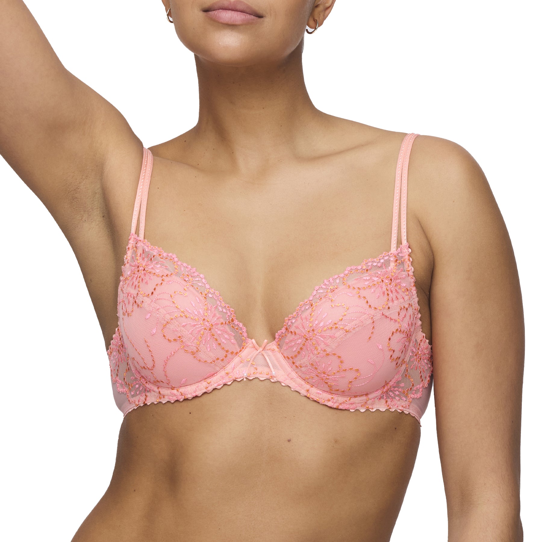 A  modal showing floral embroidery bra by Marie jo in flay layout in peachy pink colour.