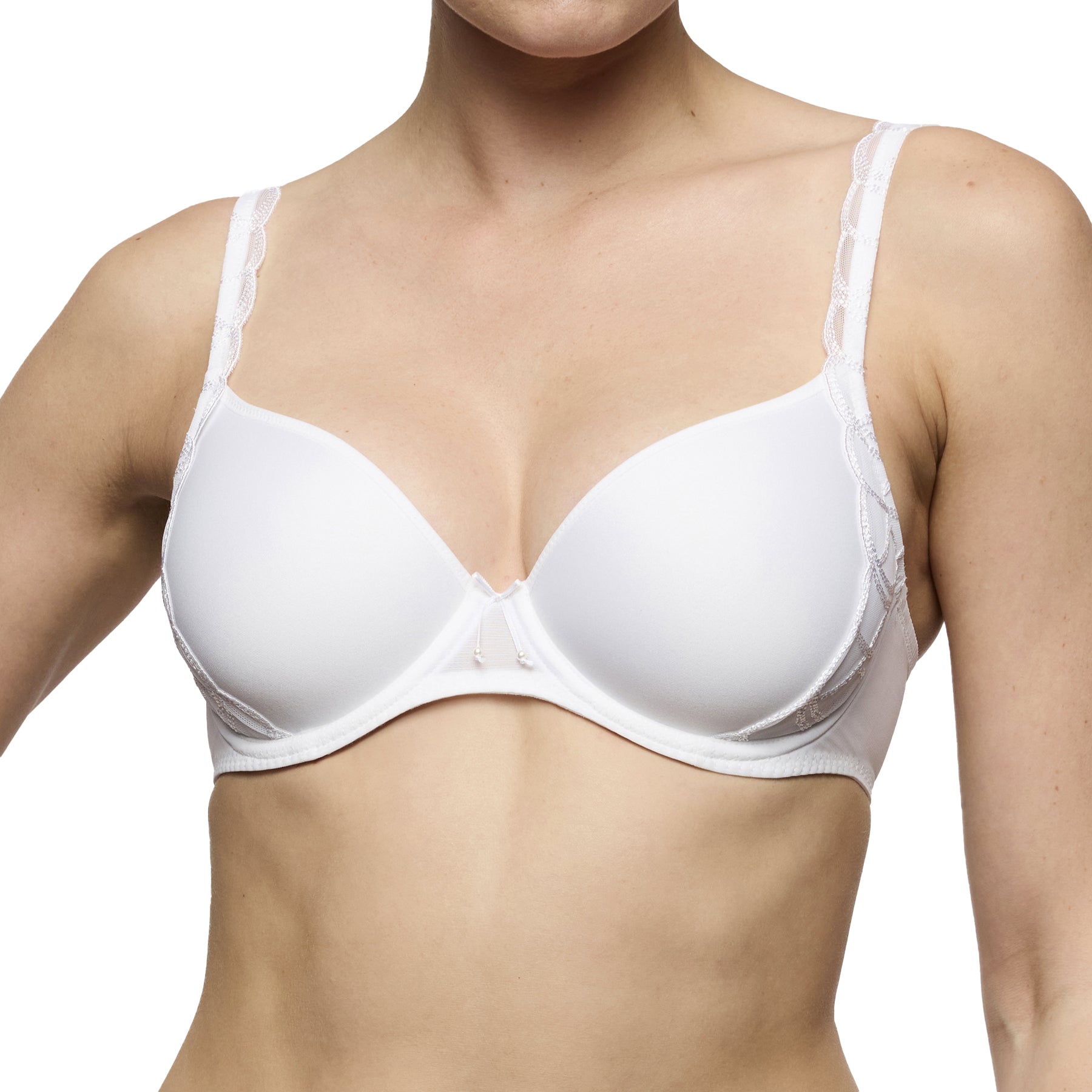 White moulded cup bra on model, featuring seamless cups, light padding, and delicate lace accents on straps.