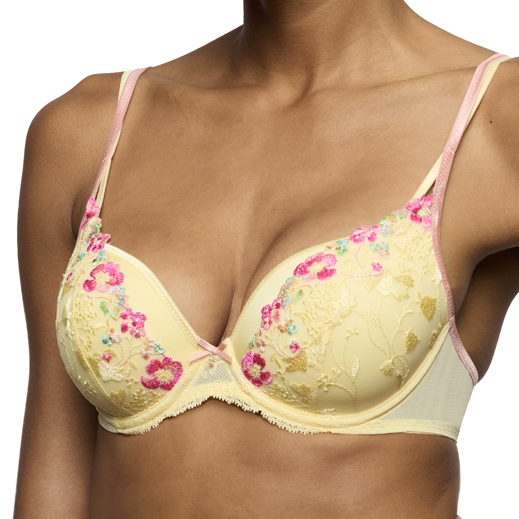 Close-up of yellow embroidered bra featuring pink floral detailing, underwire cups and delicate bow accent.