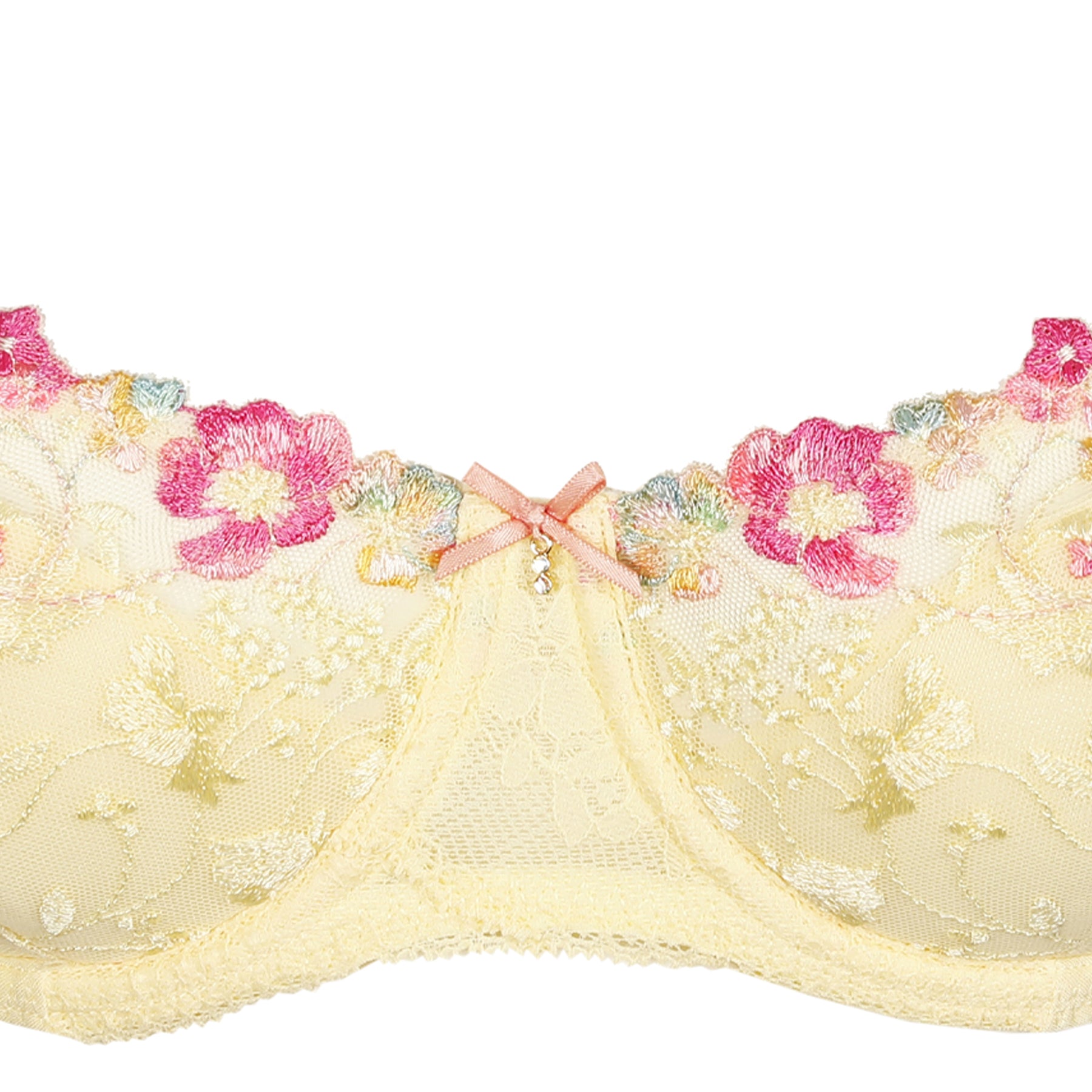 Close-up detail of French vanilla bra featuring pink floral embroidery, satin bow, and sheer lace cups.