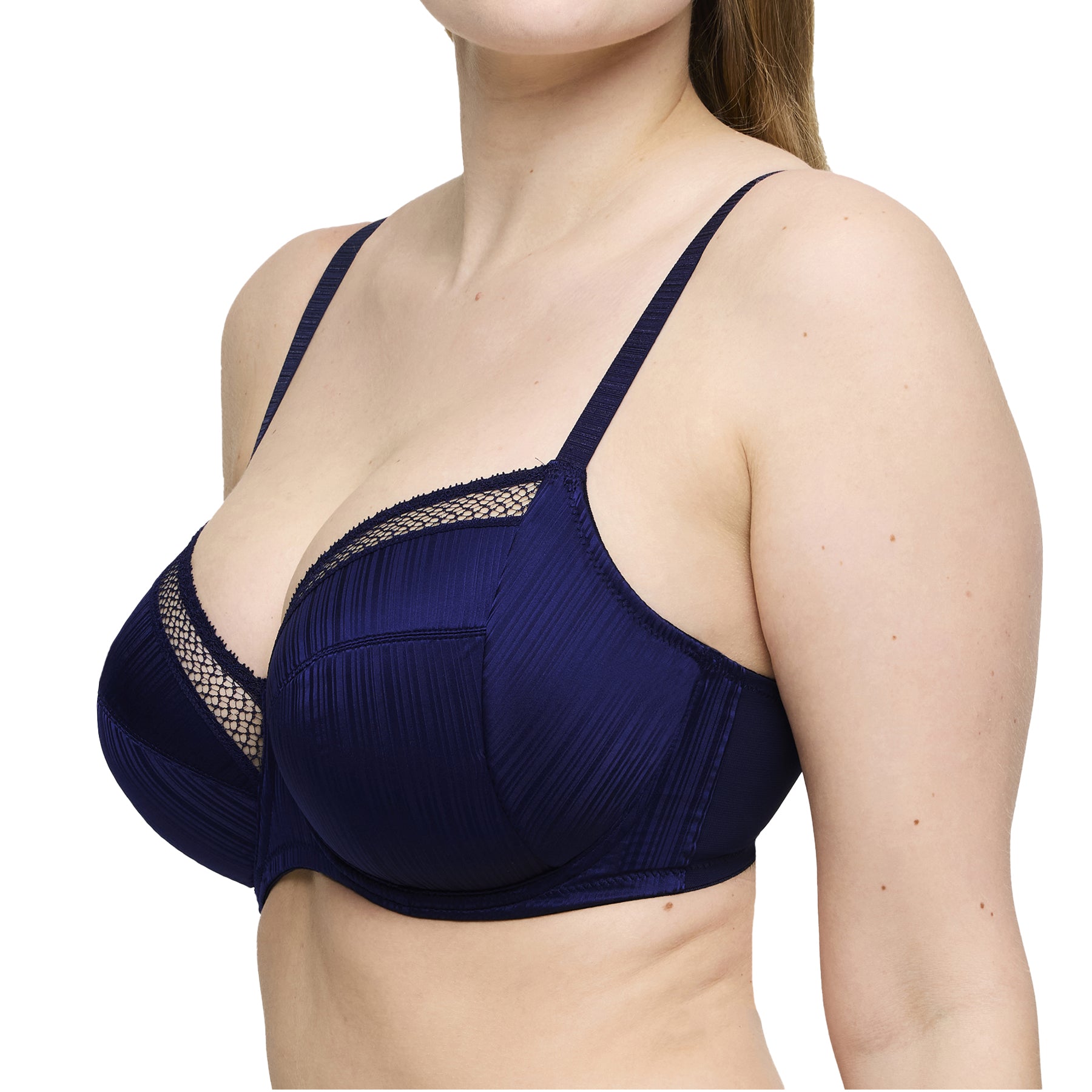 Side angle of sapphire blue bra with pleated cups and mesh detailing, showing supportive fit.