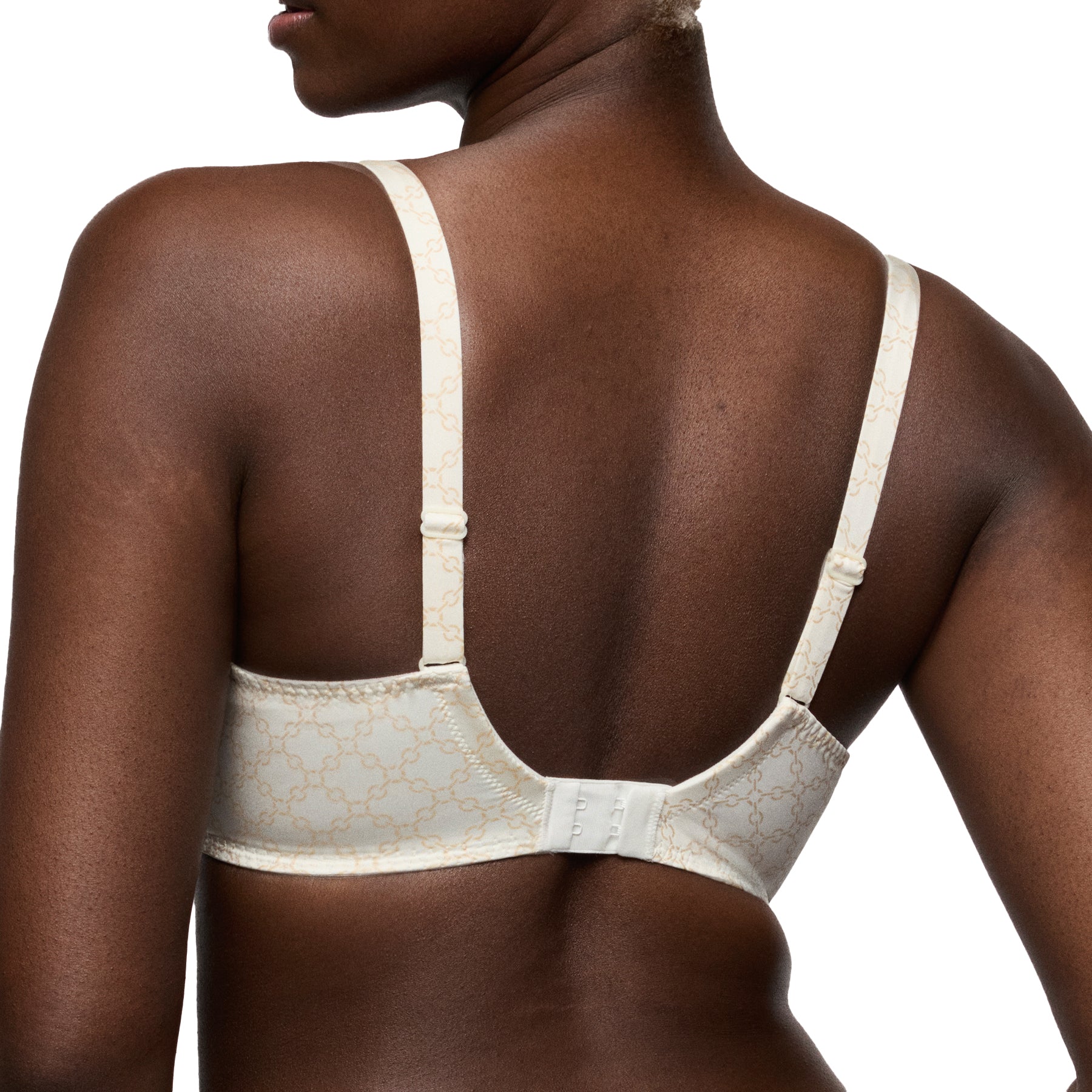 Cream patterned full cup bra back view with adjustable straps and hook closure