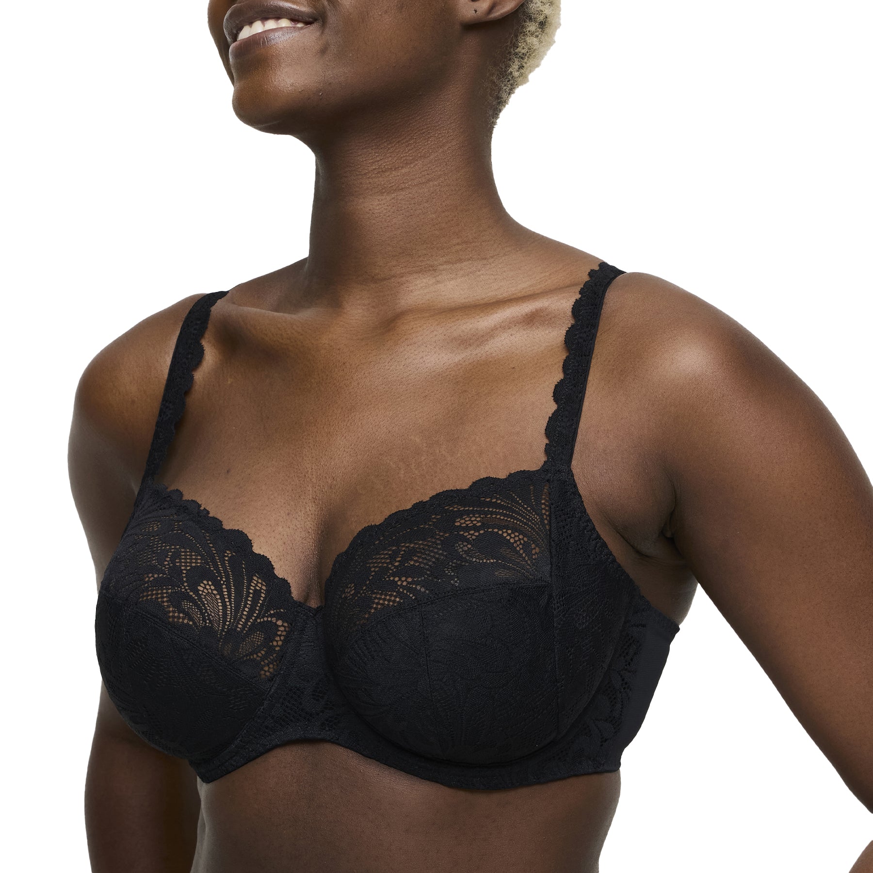 Side view of black lace underwired bra on model, showing scalloped straps.