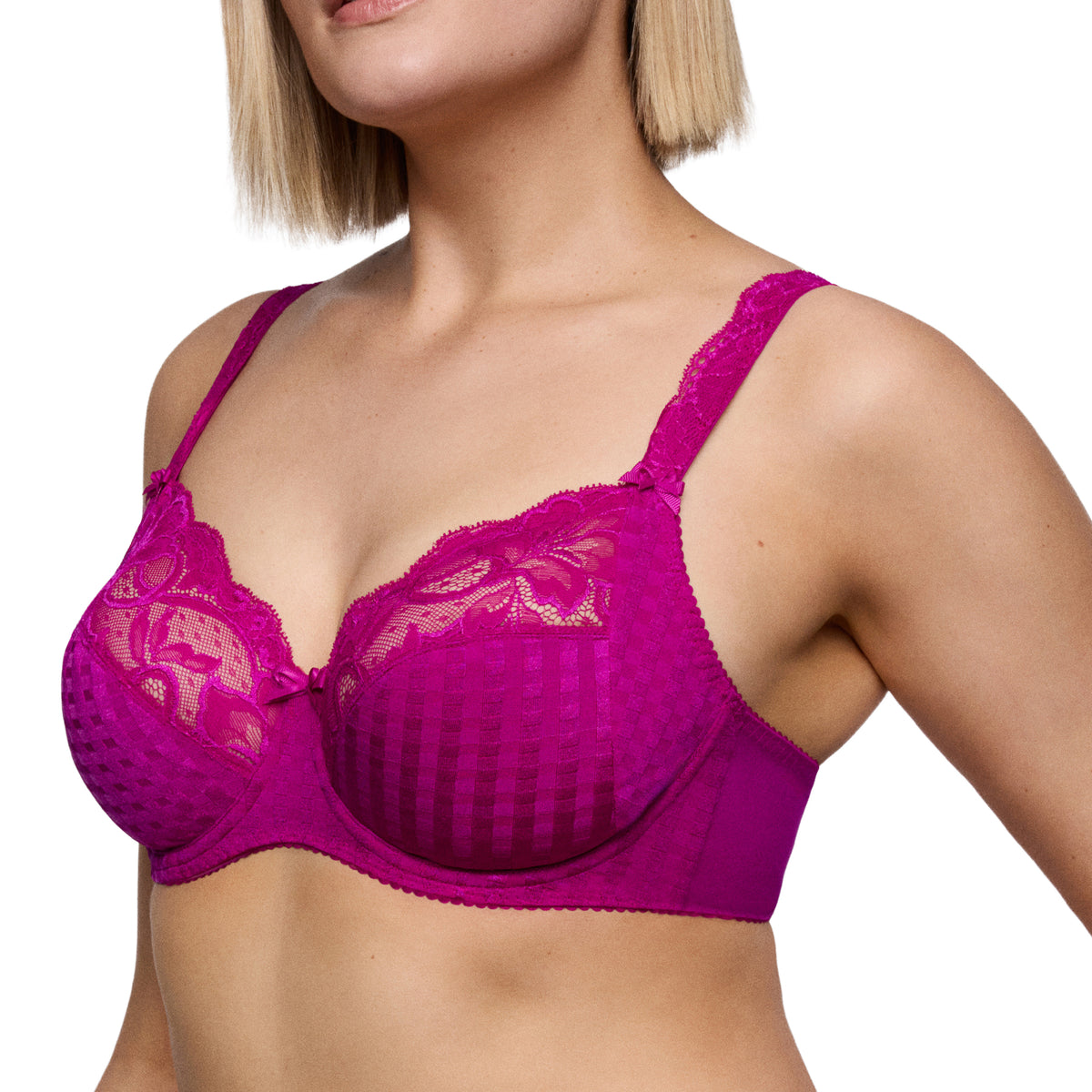 Model wearing the PrimaDonna Madison Wild Rose bra, showcasing full cups with checkered fabric, floral lace detailing and wide supportive straps.