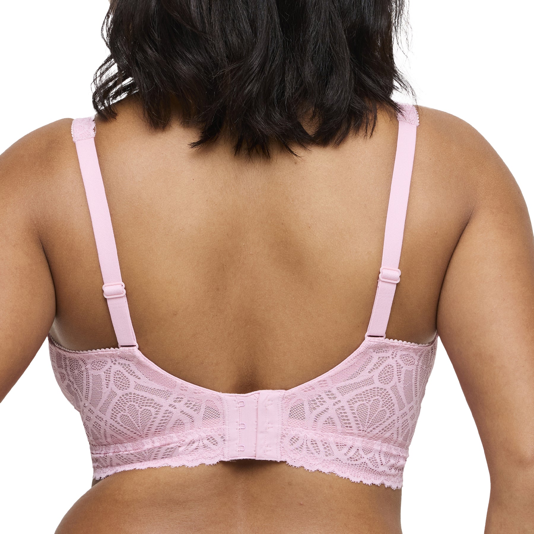 Back view of pink lace wireless bralette with adjustable straps and hook-and-eye closure.