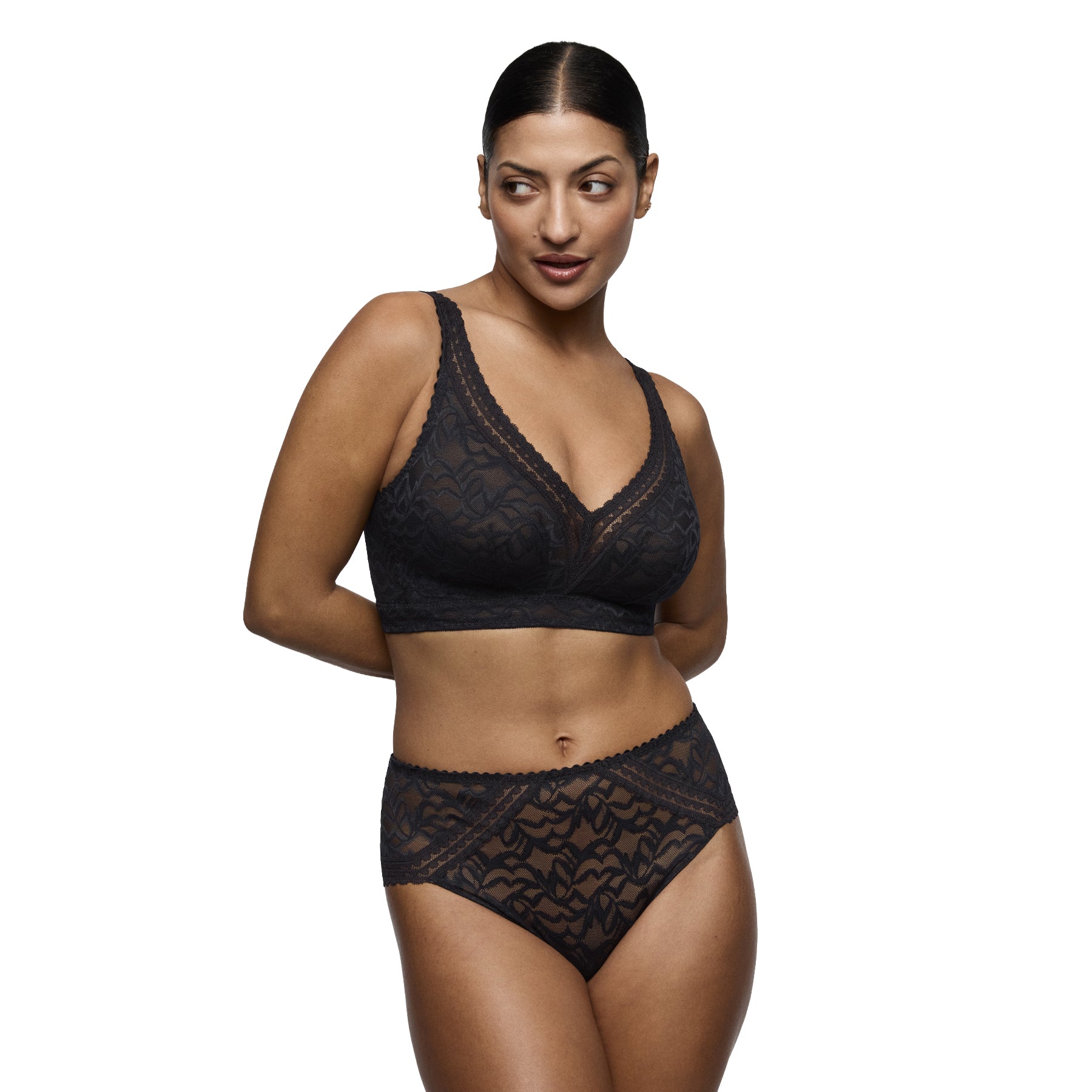 Model wearing PrimaDonna Miyara wireless black lace bra with matching lace brief.