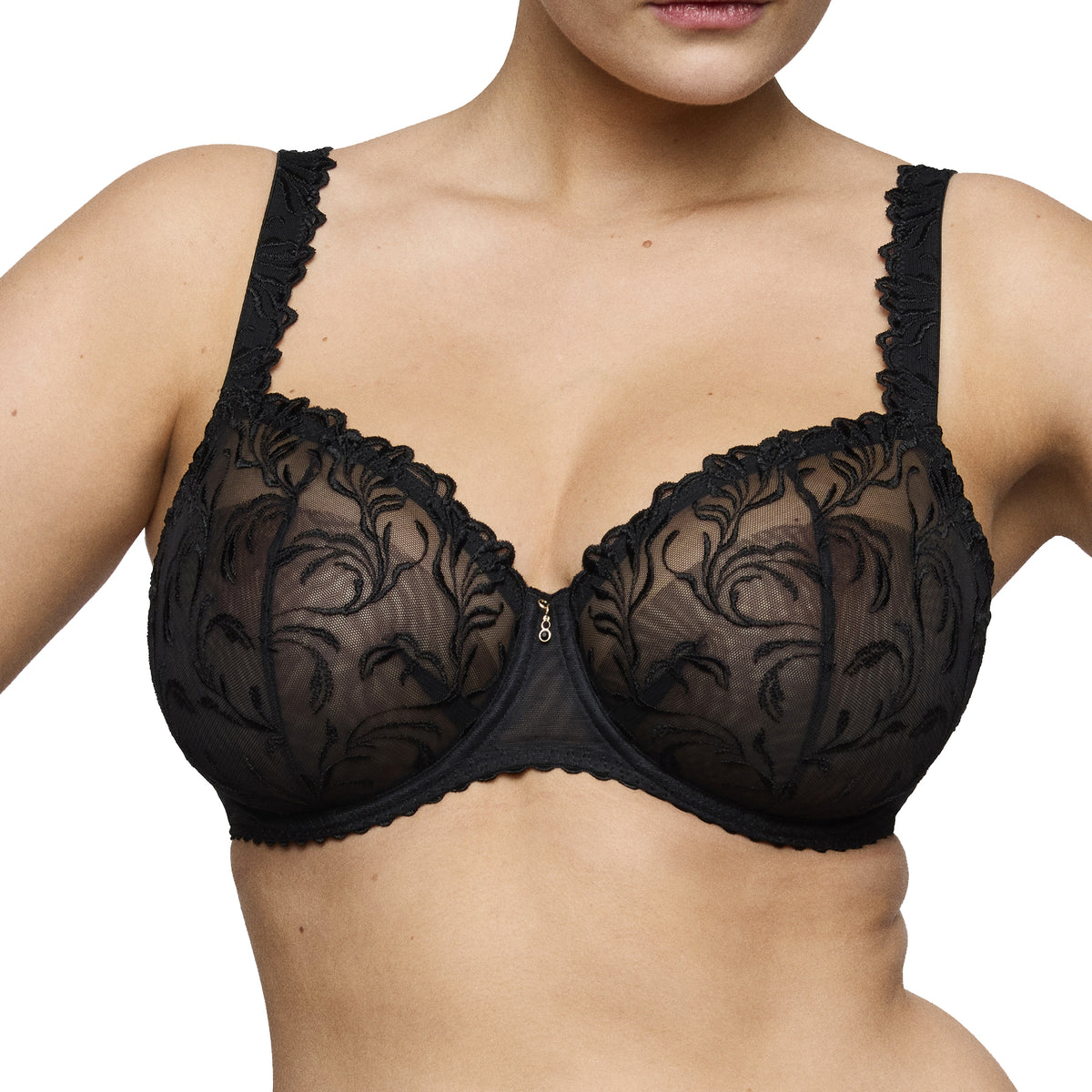 Model wearing the PrimaDonna Solisse balcony bra in black, featuring sheer floral embroidery and a supportive underwired design.