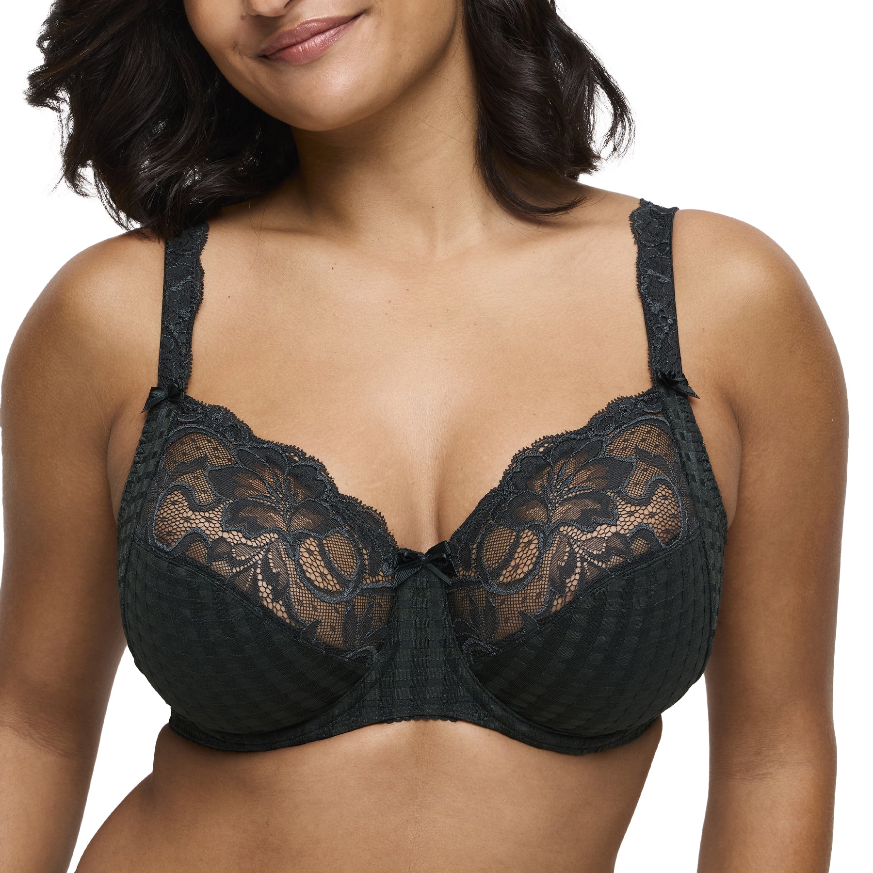 Model wearing PrimaDonna Madison bra in deep green, front view highlighting lace details.