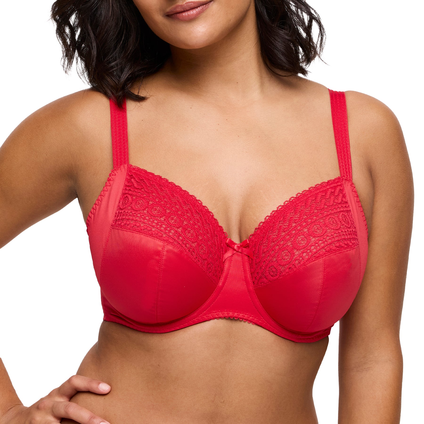 Close-up of red lace full cup bra on model, showcasing embroidered detail and centre bow.