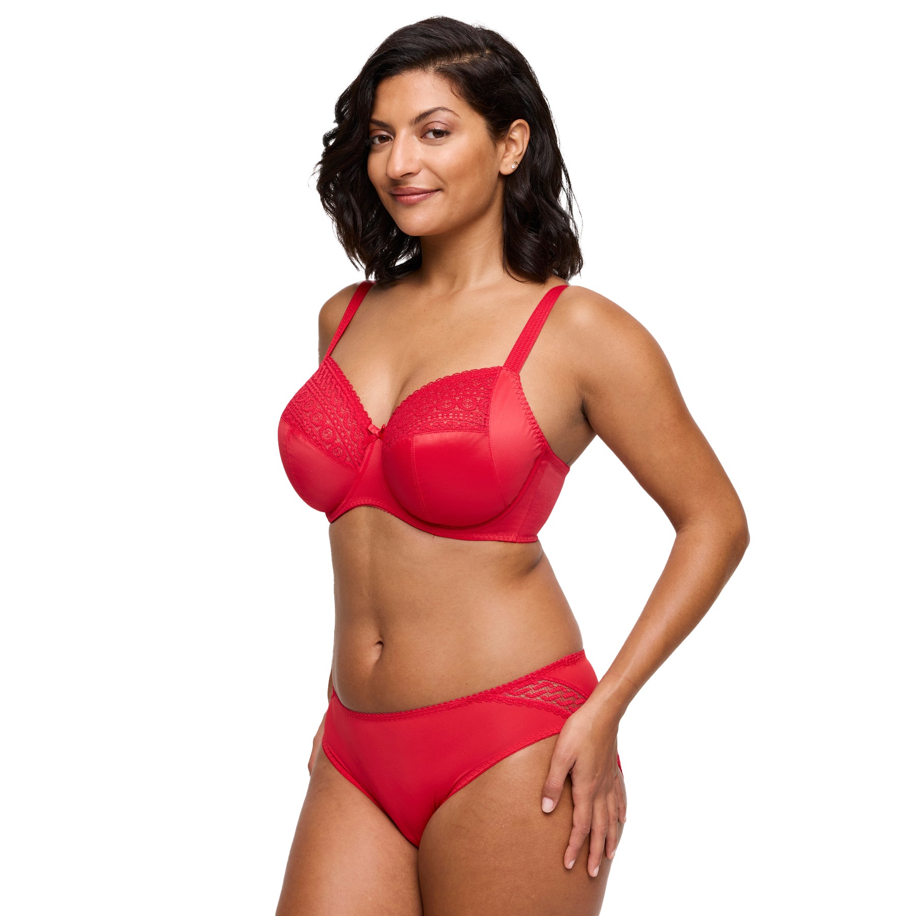 Three-quarter view of woman wearing a matching red bra and brief lingerie set.