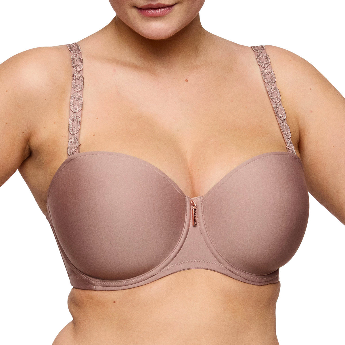 Close-up of Strapless Twist bra in Cosmetic with lace shoulder straps and smooth molded cups.
