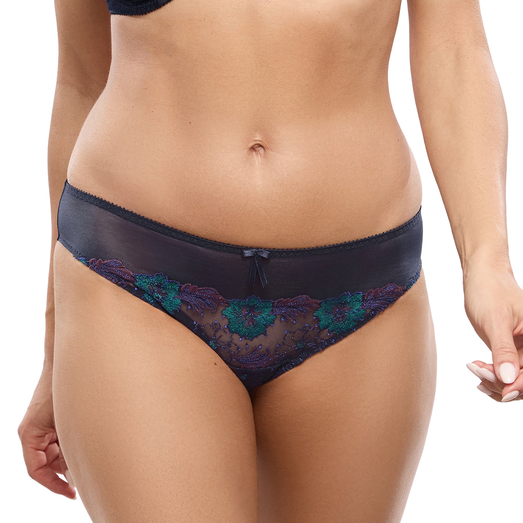Model wearing the Empreinte Clea Bikini Brief in Mystic Blue with teal and purple floral embroidery.