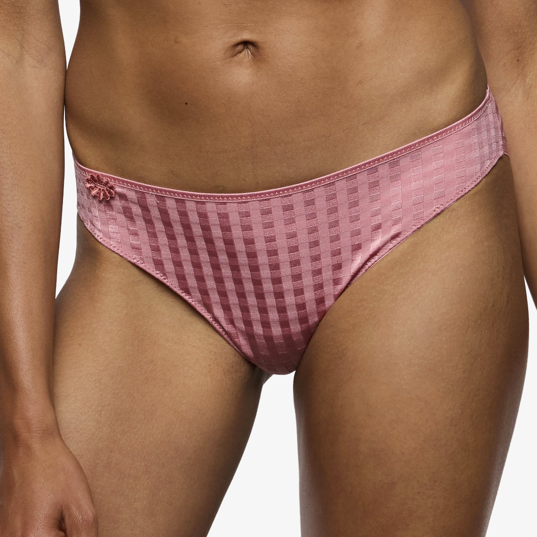 Pink bikini brief with checkered texture and soft stretch fabric on model front view