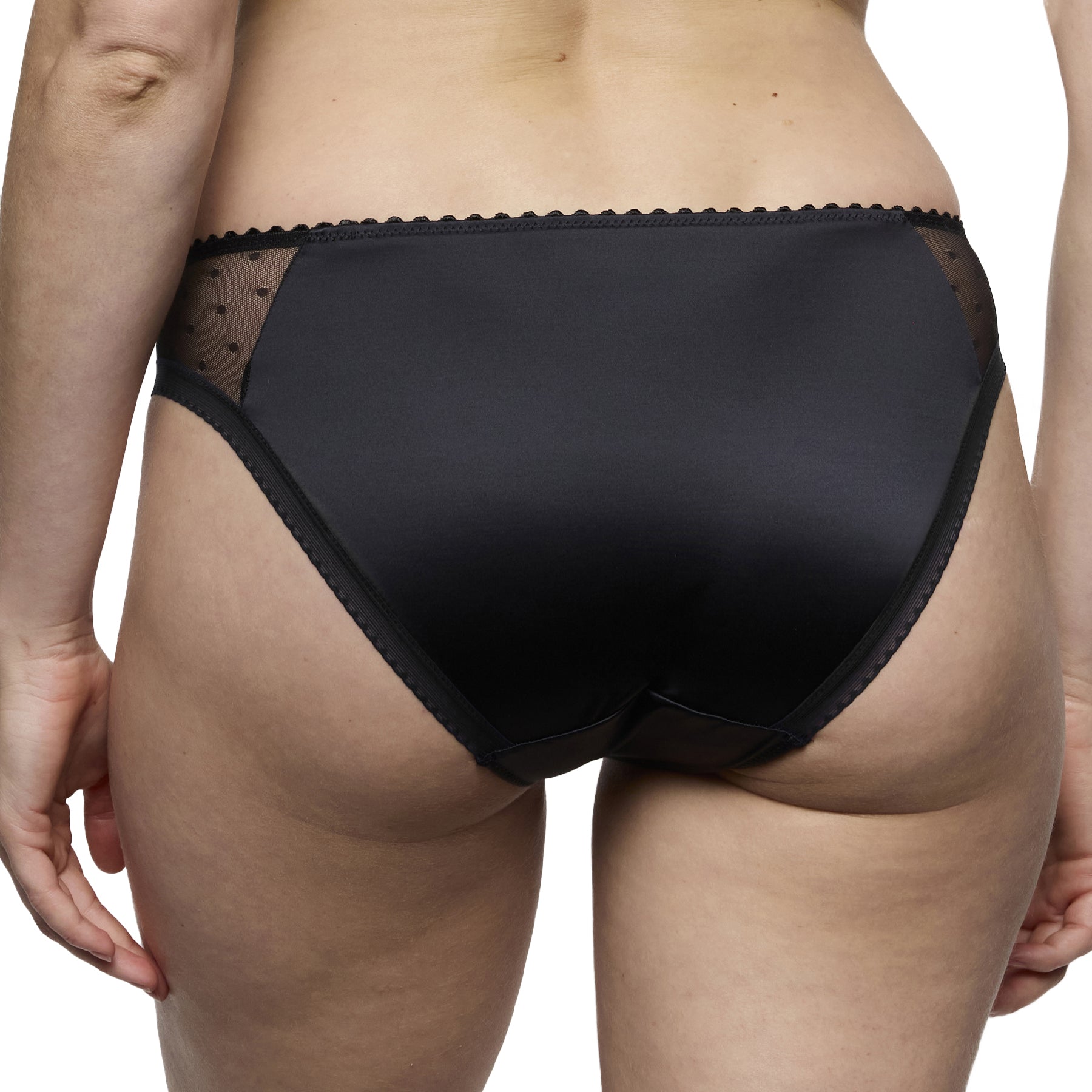 Back view of model wearing the black Marie Jo Noova rio brief showing smooth full coverage and soft scalloped edging.