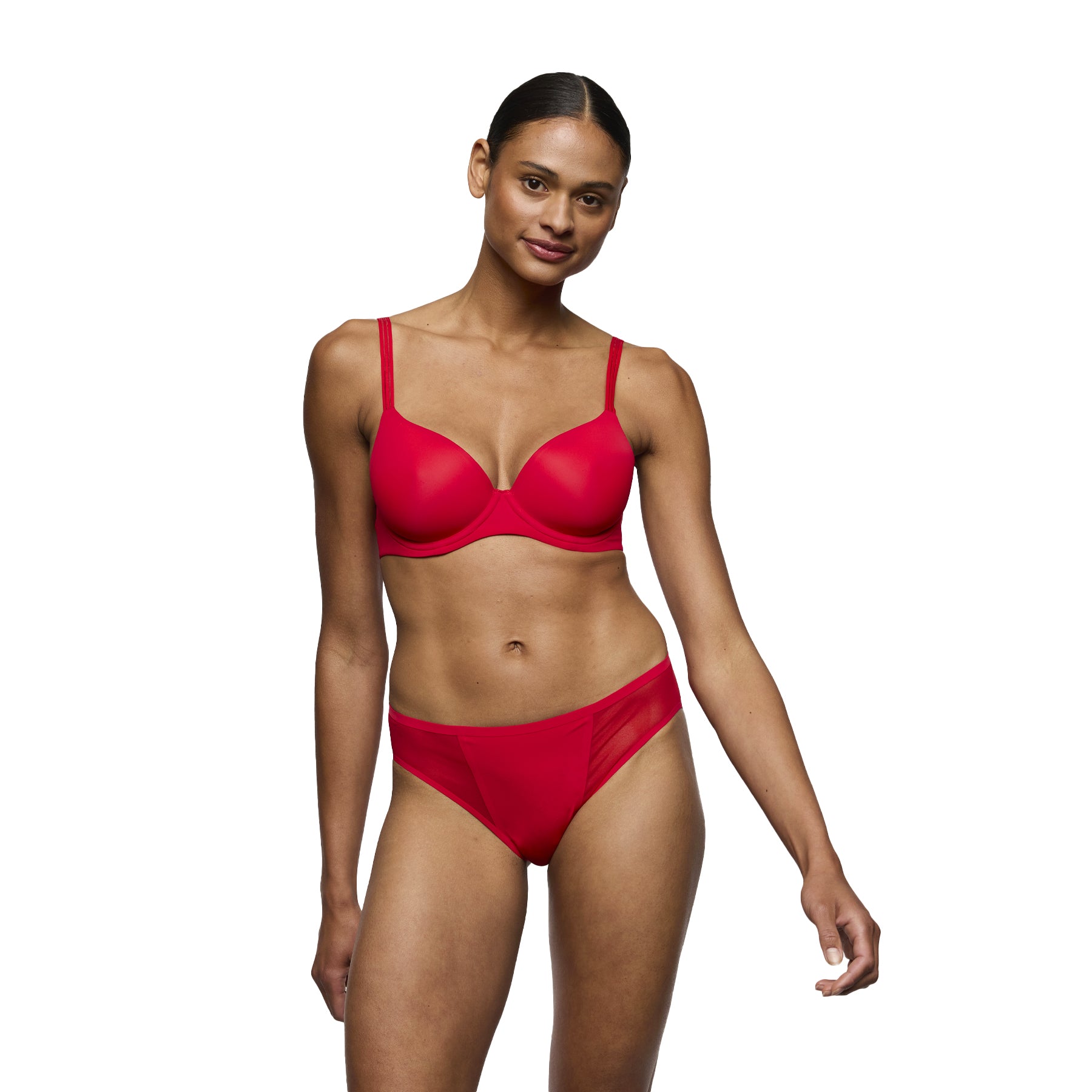Woman wearing a red bikini set on a white background