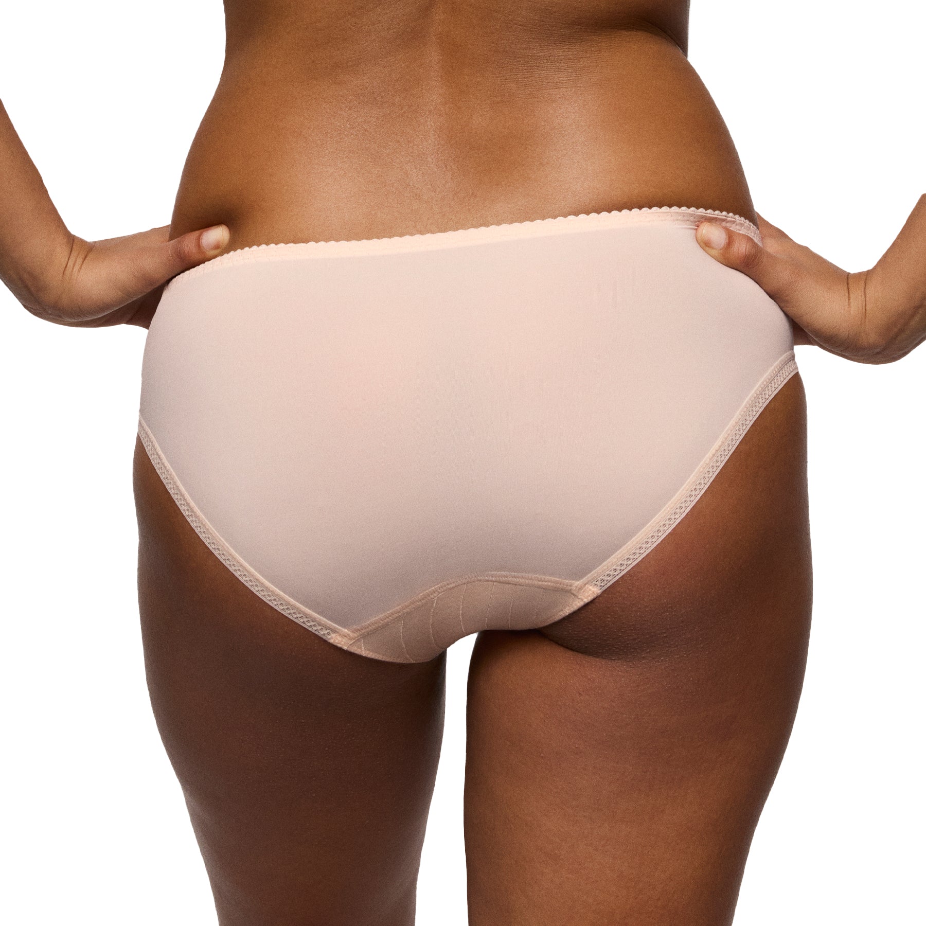 Back view of a nude mid-rise brief with smooth microfibre fabric and clean, seamless coverage on a model.