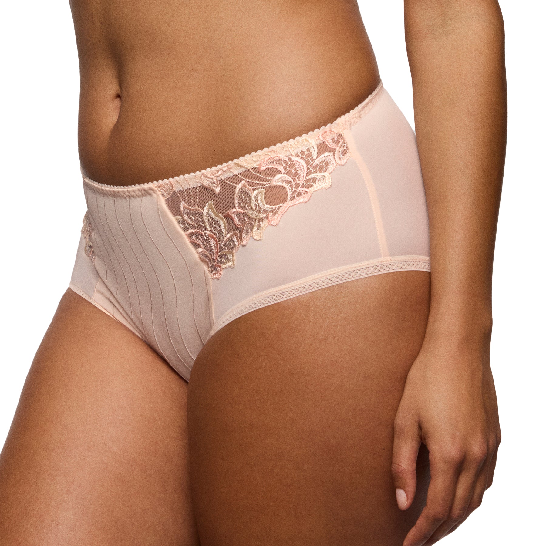 Angled side view of a blush full brief showcasing sheer lace panels, smooth coverage, and refined edge detailing.