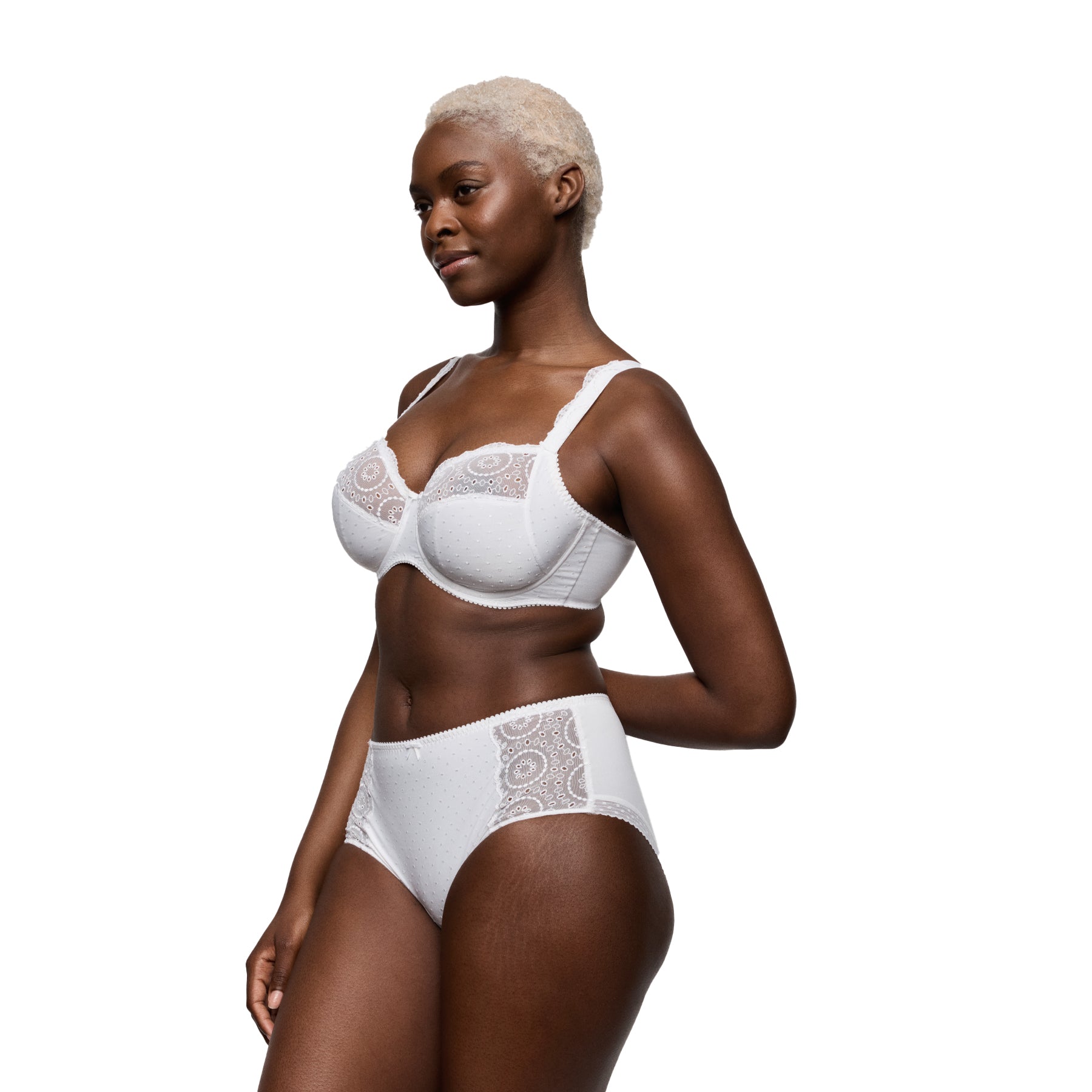 Model wearing white full brief style 056-3311 with embroidered lace side panels and soft dotted fabric front.