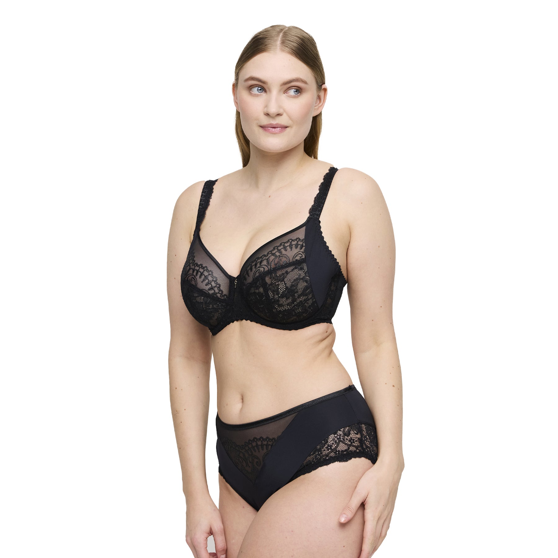 Woman in black lace full cup bra and matching lace briefs, front view.