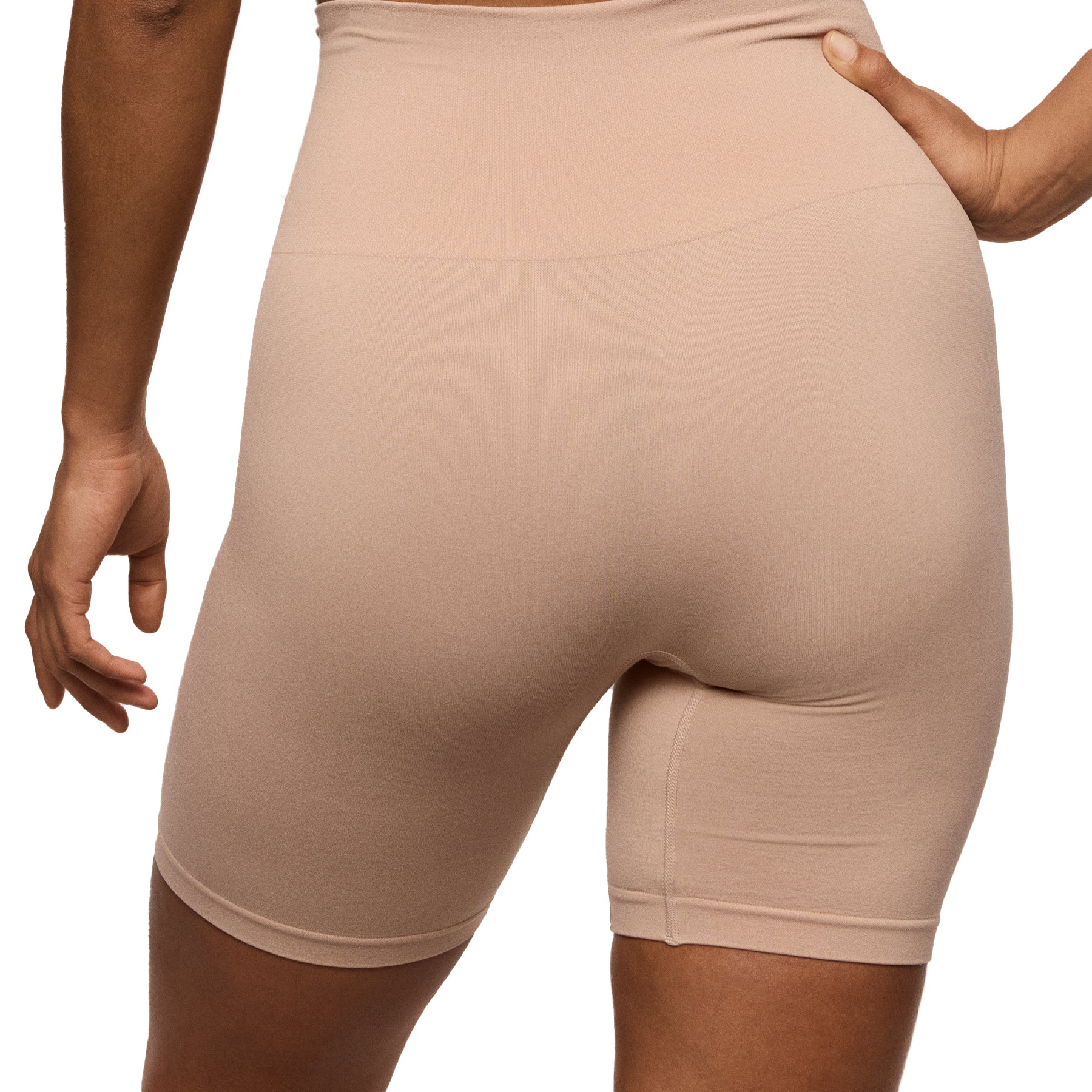 Back view of nude high-waisted seamless shaping shorts with thigh coverage