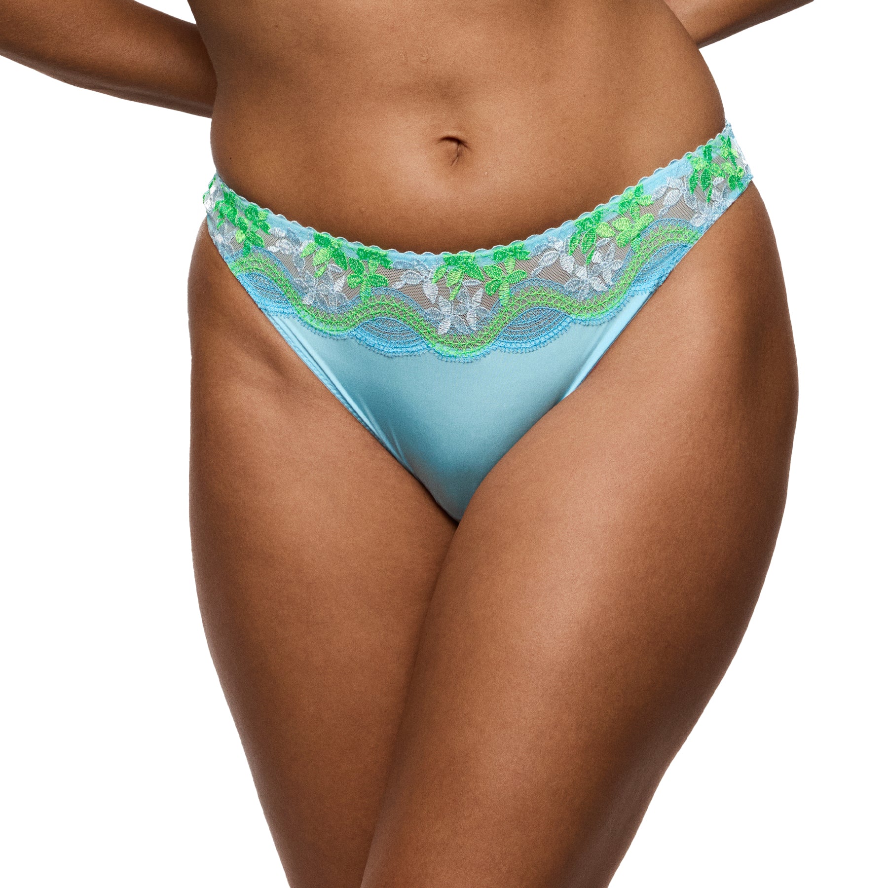 Light blue lace thong with scalloped embroidered waistband, worn on model, front view