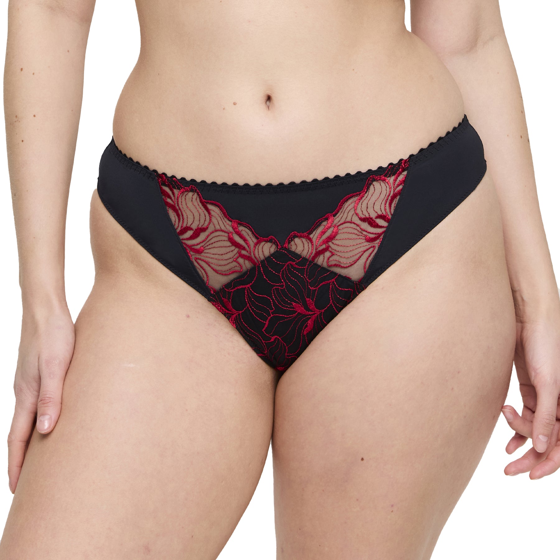 Front view of embroidered lace thong in black and red sheer fabric.