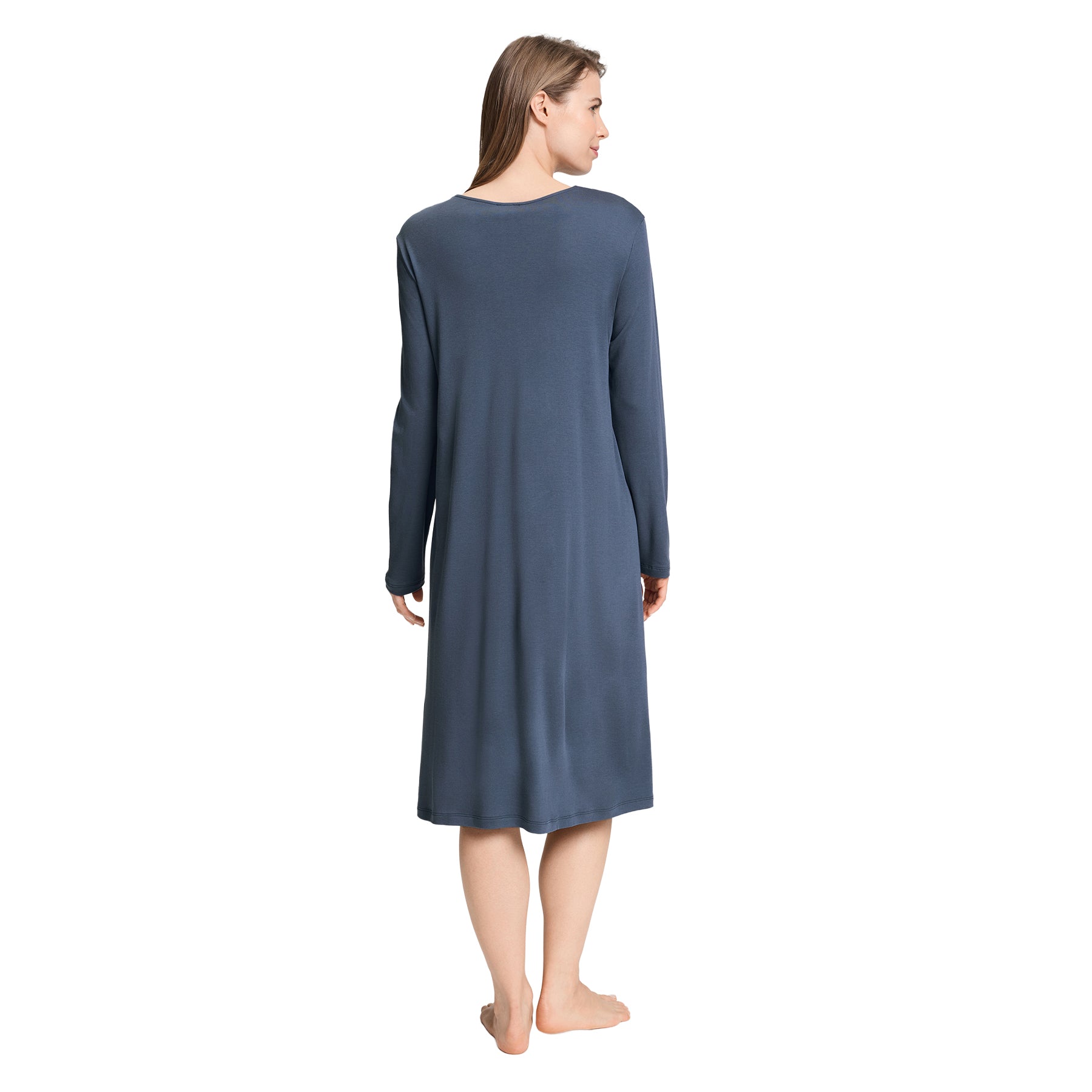 Back view of a woman wearing a blue long-sleeve midi nightgown with a relaxed, flowing silhouette.