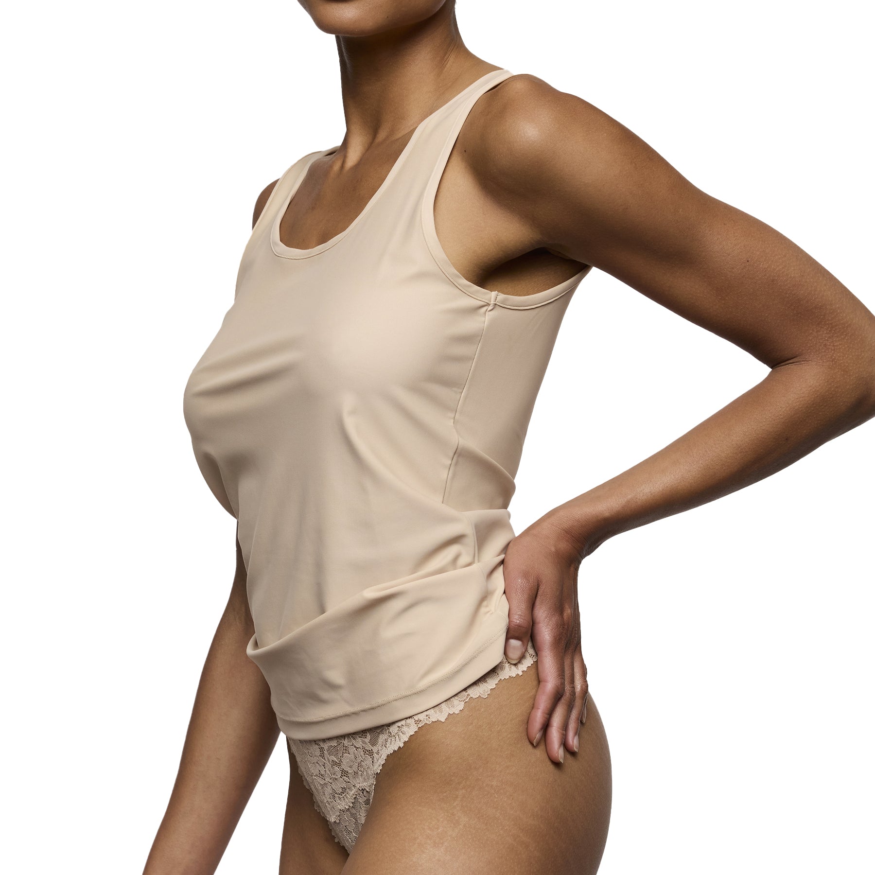 Nude seamless camisole tank with wide straps and smooth lightweight fabric for everyday layering