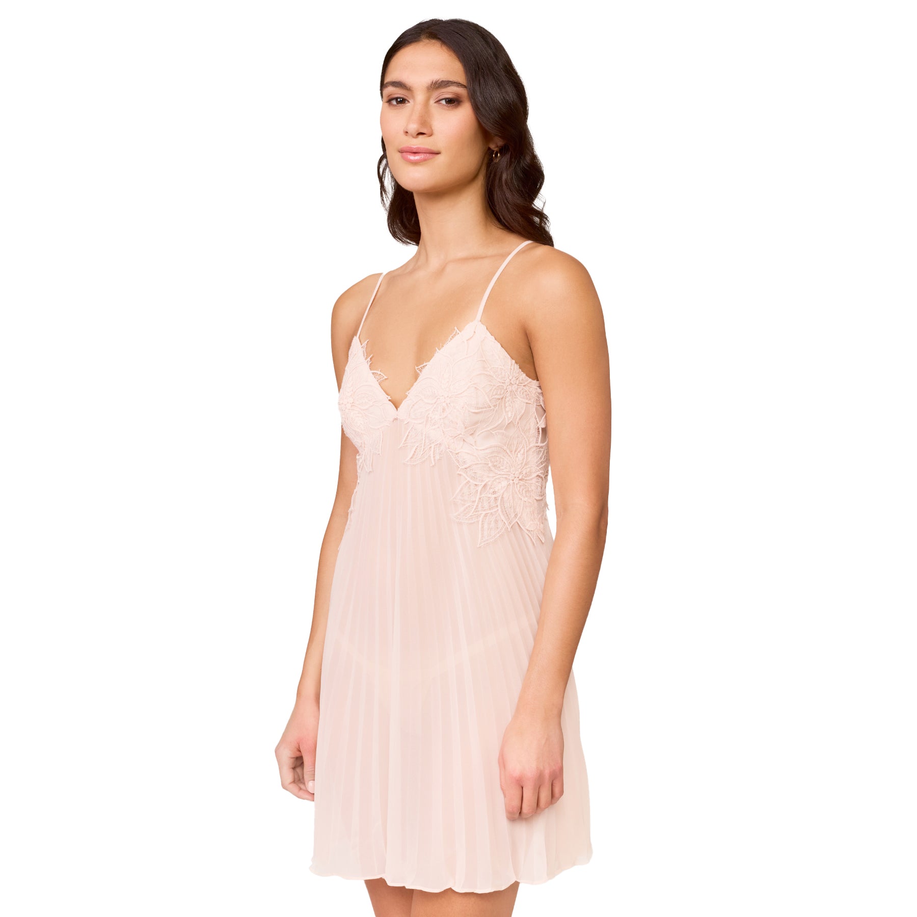 Front view of blush chemise featuring intricate lace bodice, thin straps and airy pleated fabric