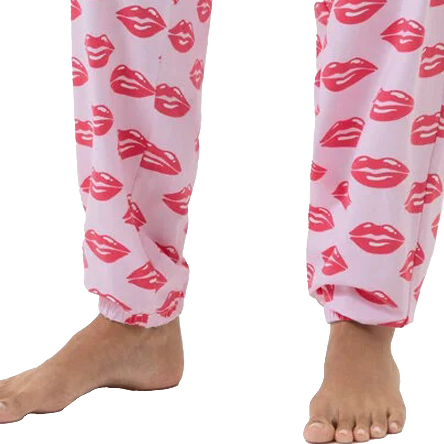 Close-up of ankles showing elastic cuff detail on pink jogger pants with red lips print.