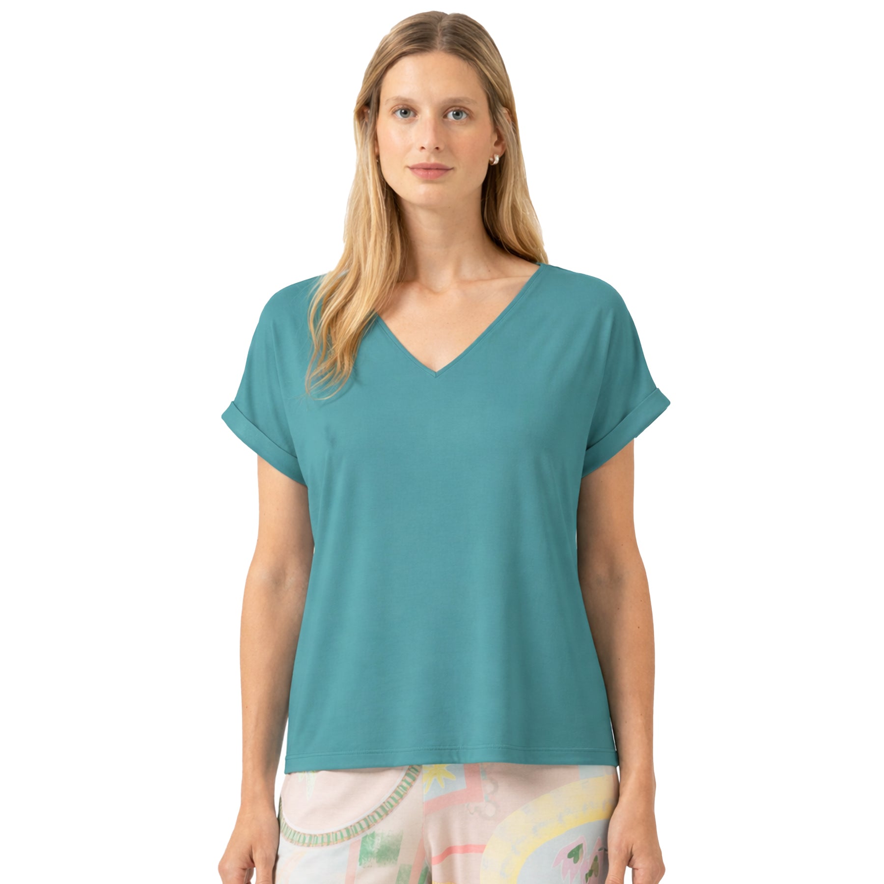 Woman wearing a teal t-shirt on a white background