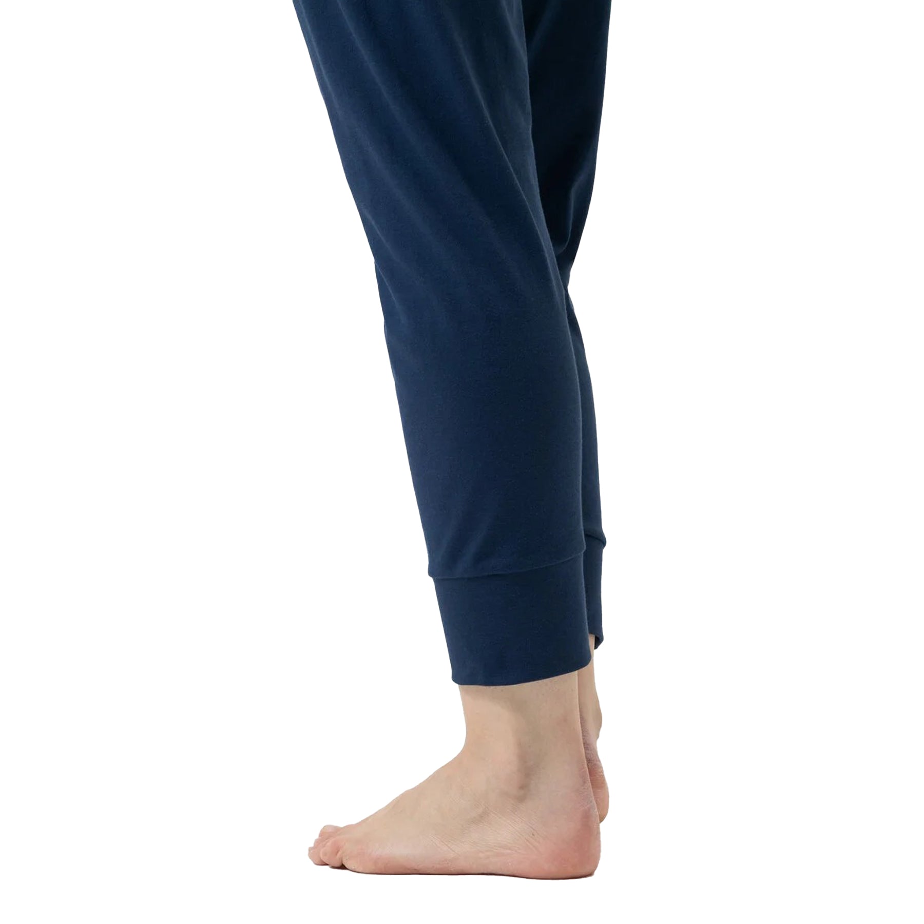 Close-up of ankle cuff detail on solid navy pajama pants.