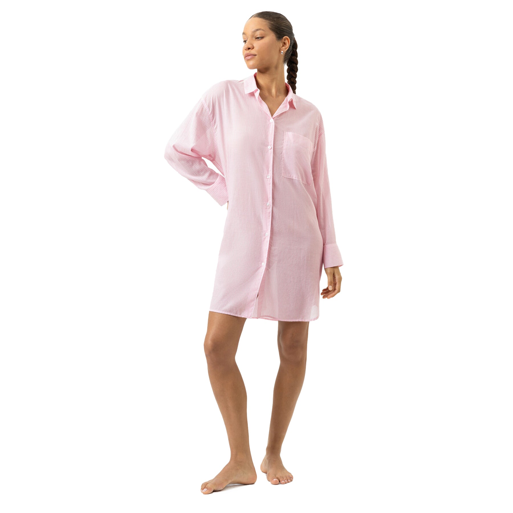 Woman wearing pink striped long sleeve button-front nightshirt sleep dress