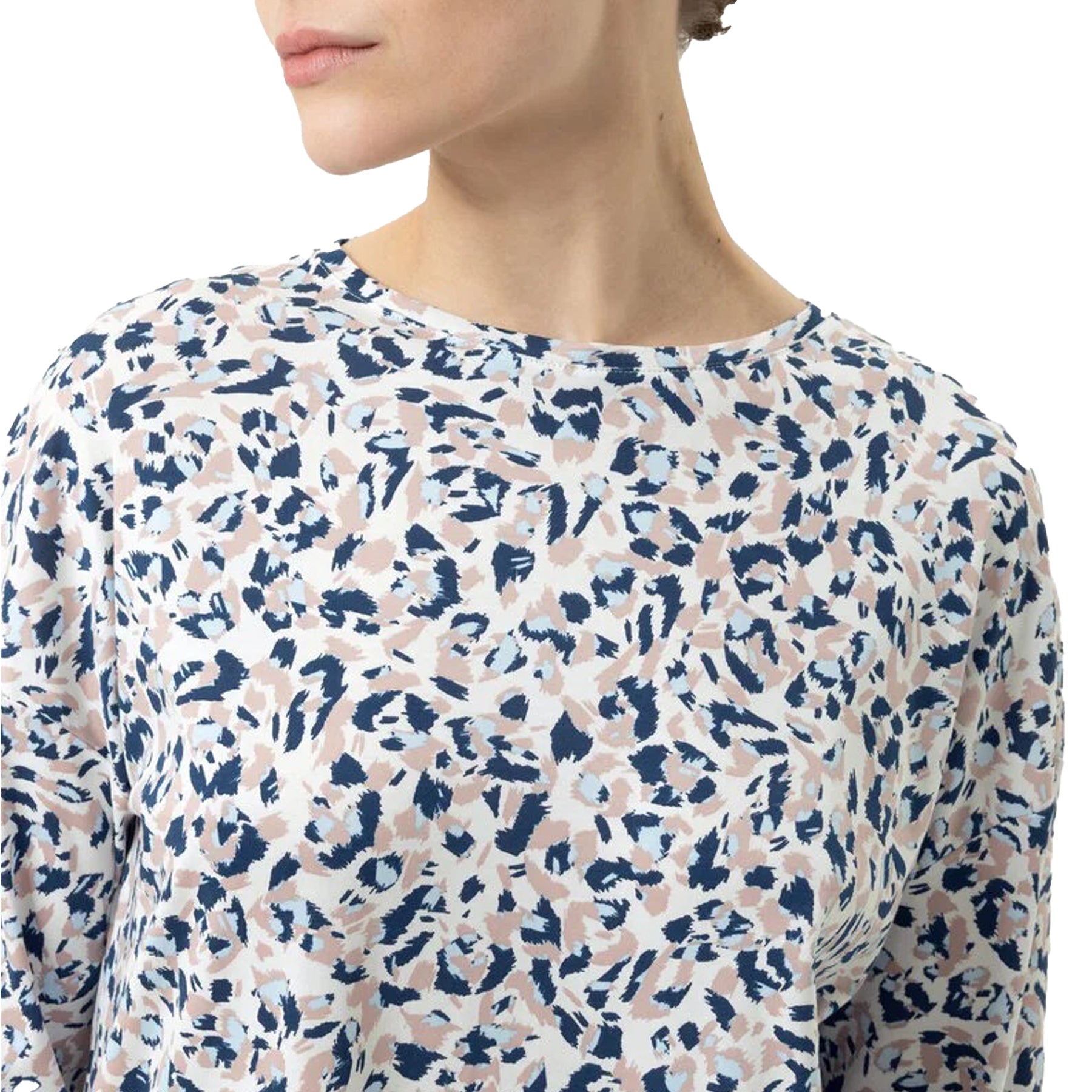 Close-up of neckline and upper chest of white nightgown with navy and beige abstract print.