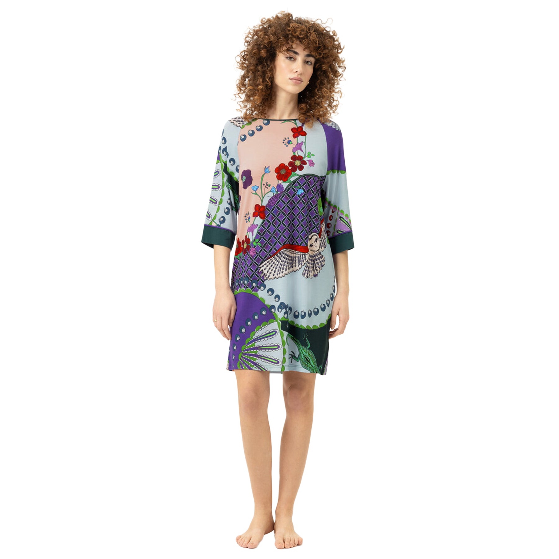 Model wearing the Mey Secret Glade sleep shirt featuring an artistic floral and owl print, relaxed fit, three-quarter sleeves, and a knee-length silhouette.