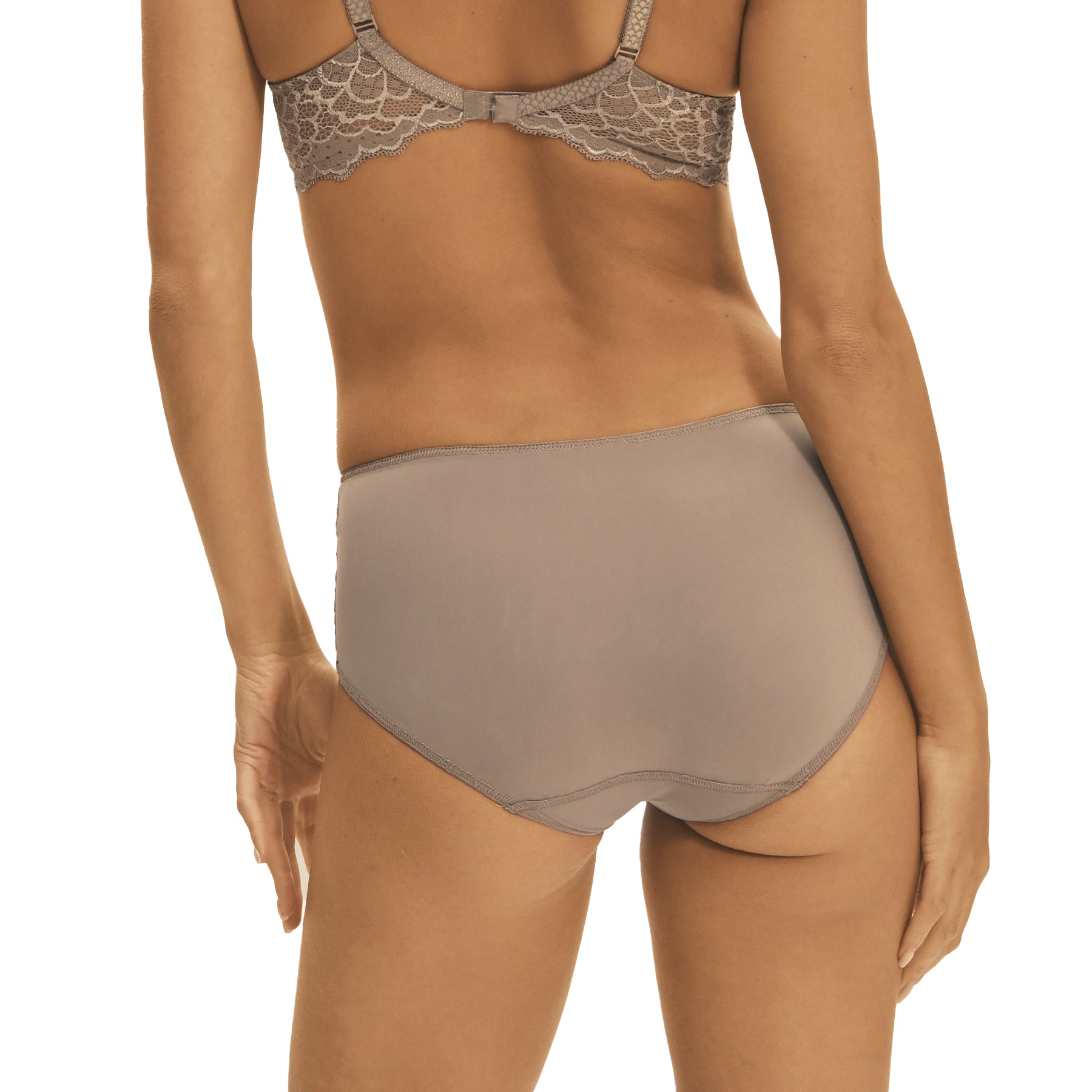 A model showing a grey/nude full brief seamless panty on a white background.