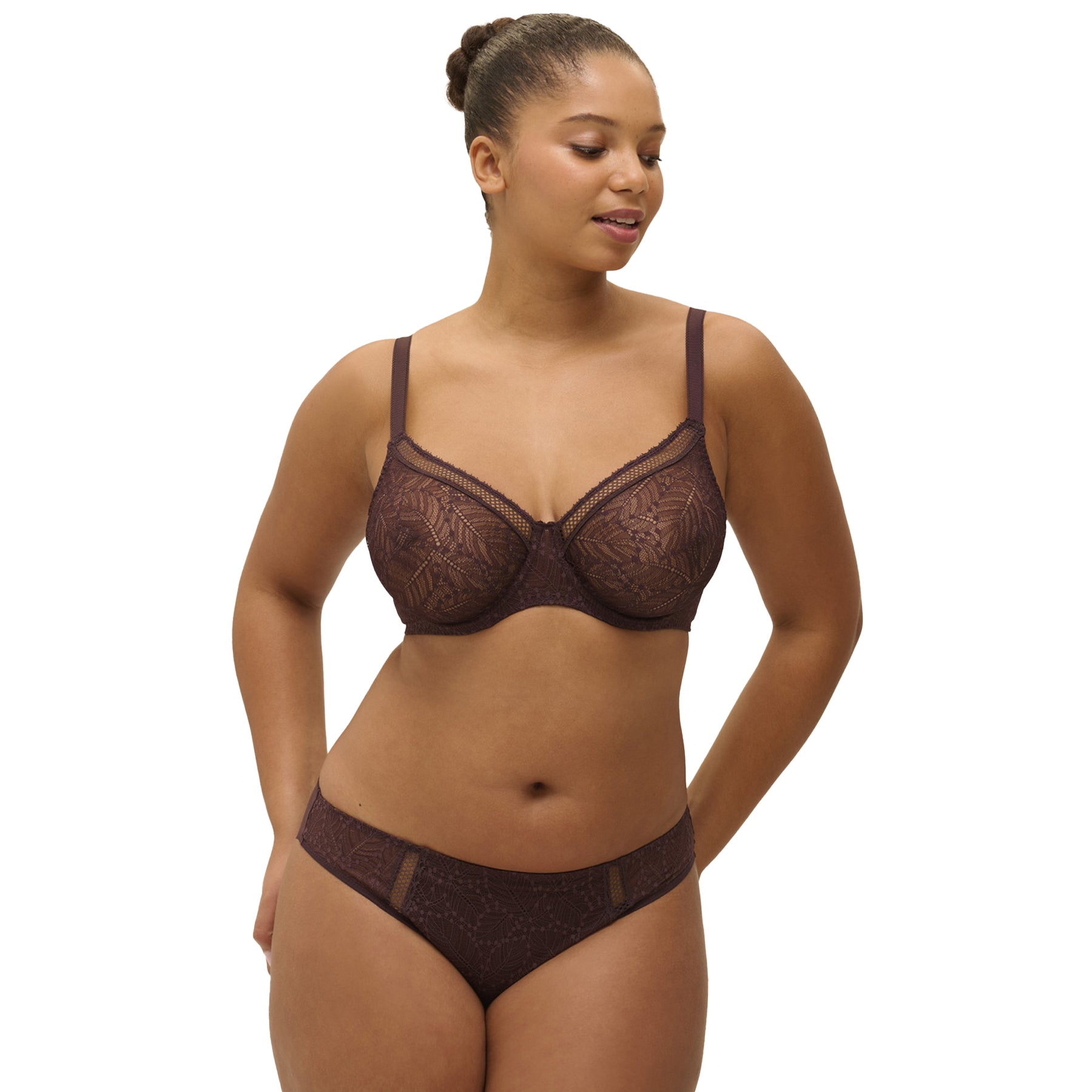 Model wearing chocolate lace bikini and matching bra – flattering cut with delicate lace design.