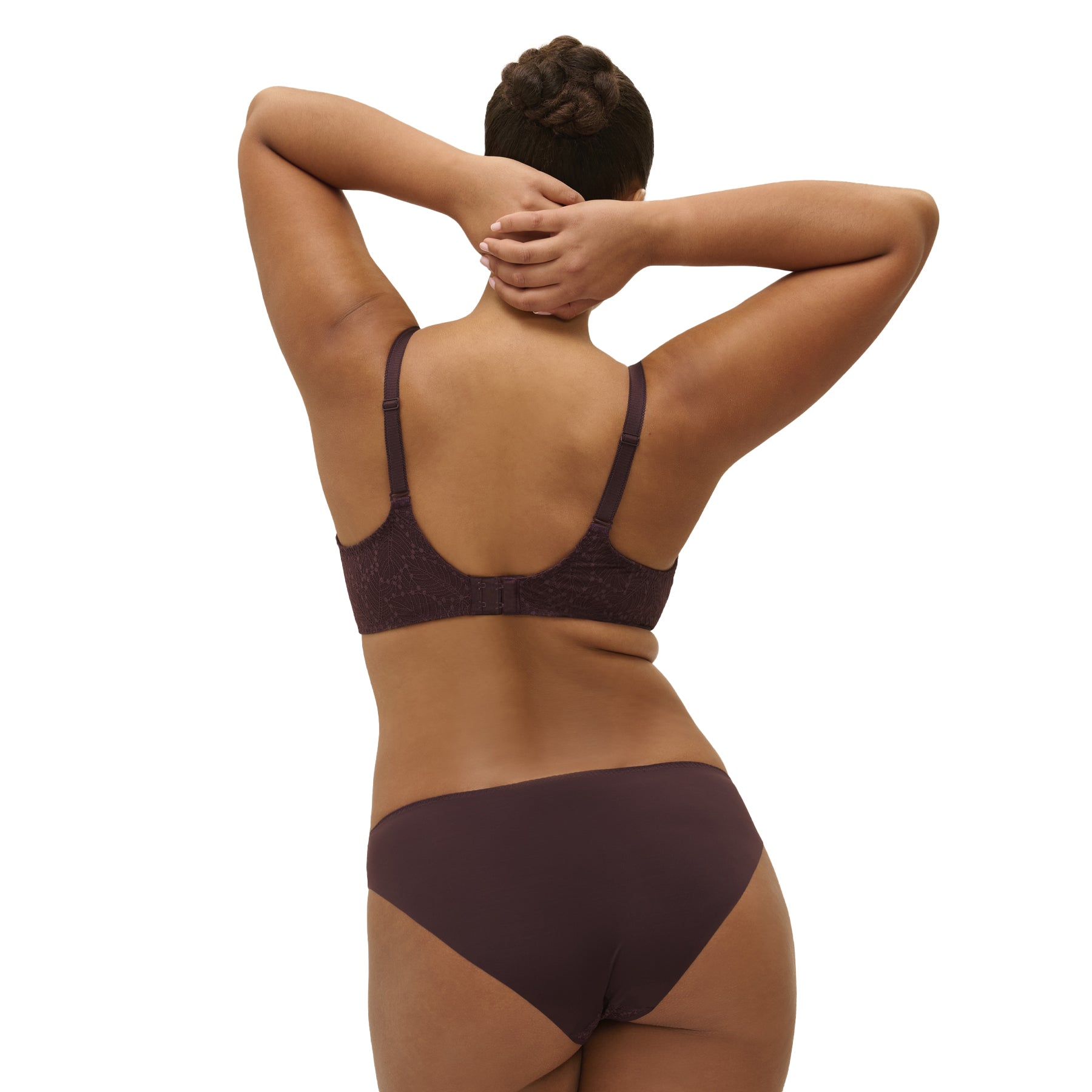 Rear view of chocolate bikini with smooth back coverage – paired with matching bra, model arms up.